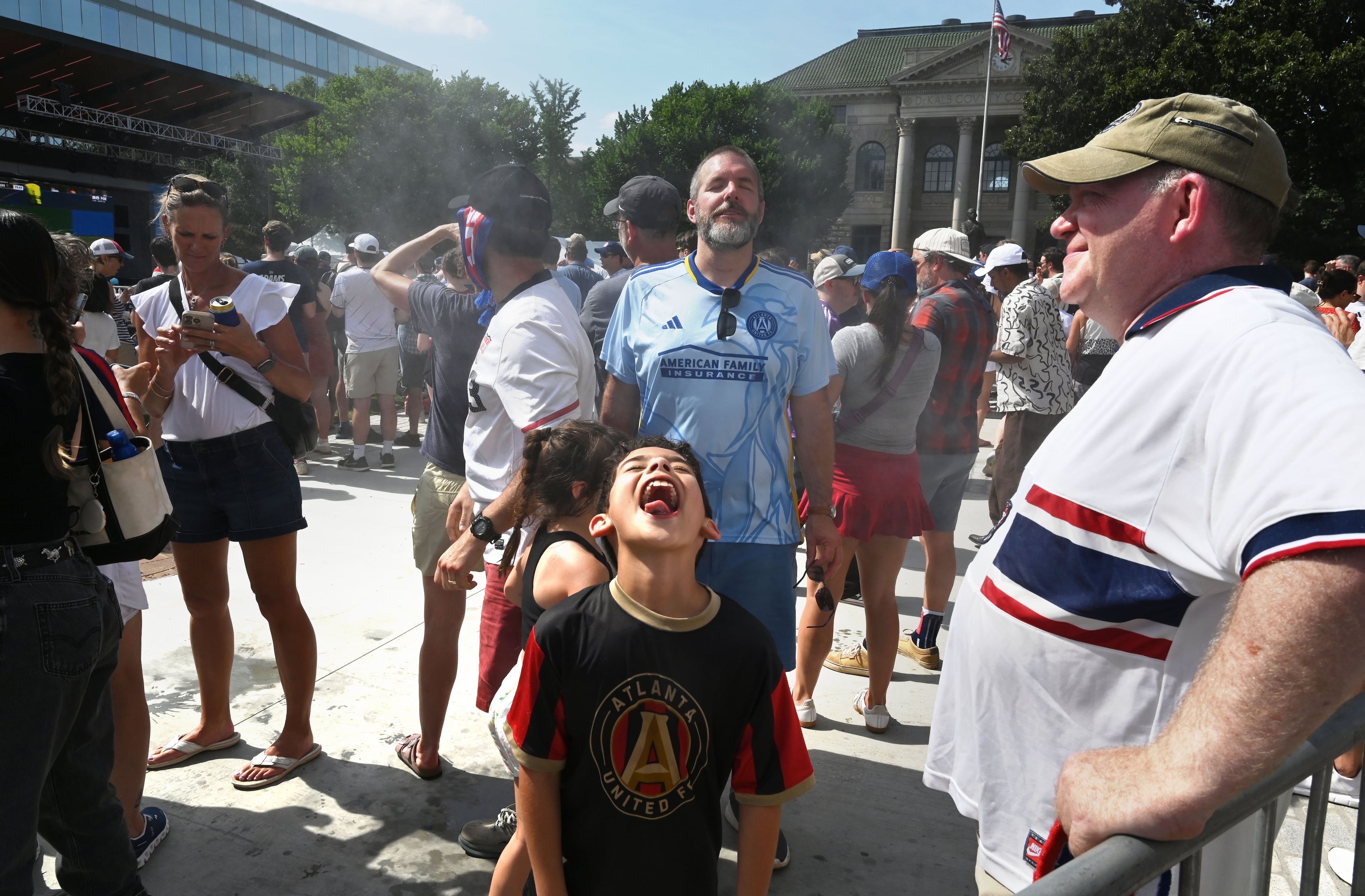 USA soccer fans cool down at halftime of the USA vs. Australia game during Decatur WatchFest at Decatur Square on Friday, June 19, 2026. (Hyosub Shin/AJC)