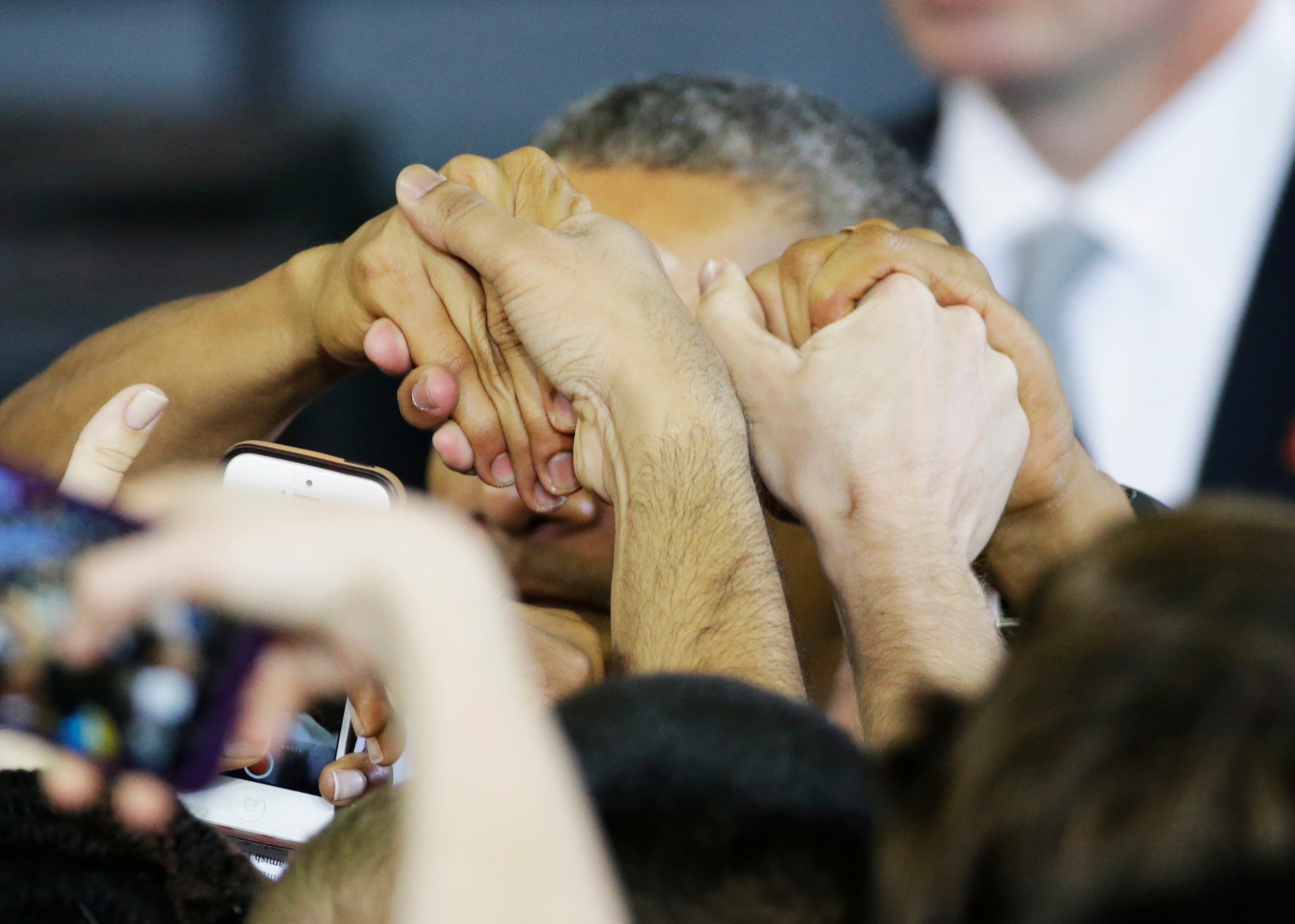 President Barack Obama greets members of the crowd as he leaves after speaking at Georgia Tech Tuesday, March 10, 2015, in Atlanta. More than 40 million Americans are in debt thanks to their education, and most of their loans come from Uncle Sam. So President Barack Obama is aiming to clamp down on the private companies that service federal student debt with a presidential memorandum he signed Tuesday. (AP Photo/David Goldman)
