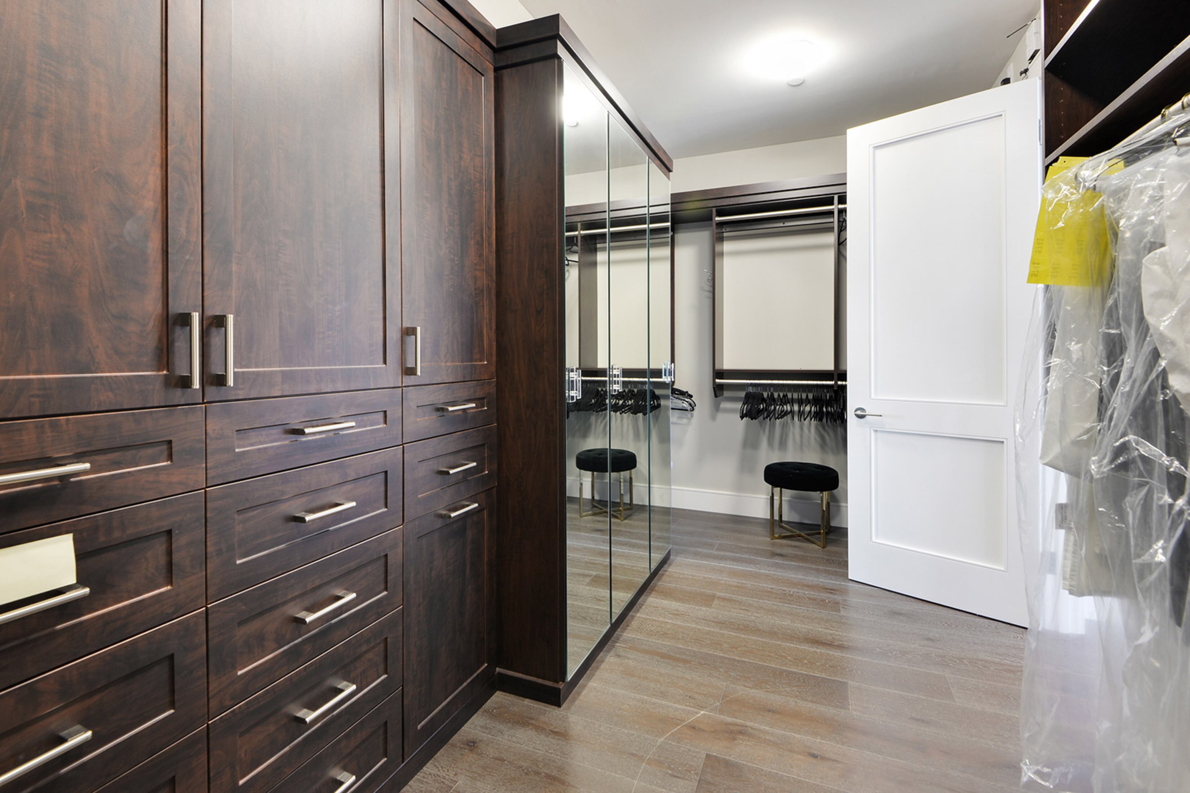 Store clothes for every season in the large walk-in closet.