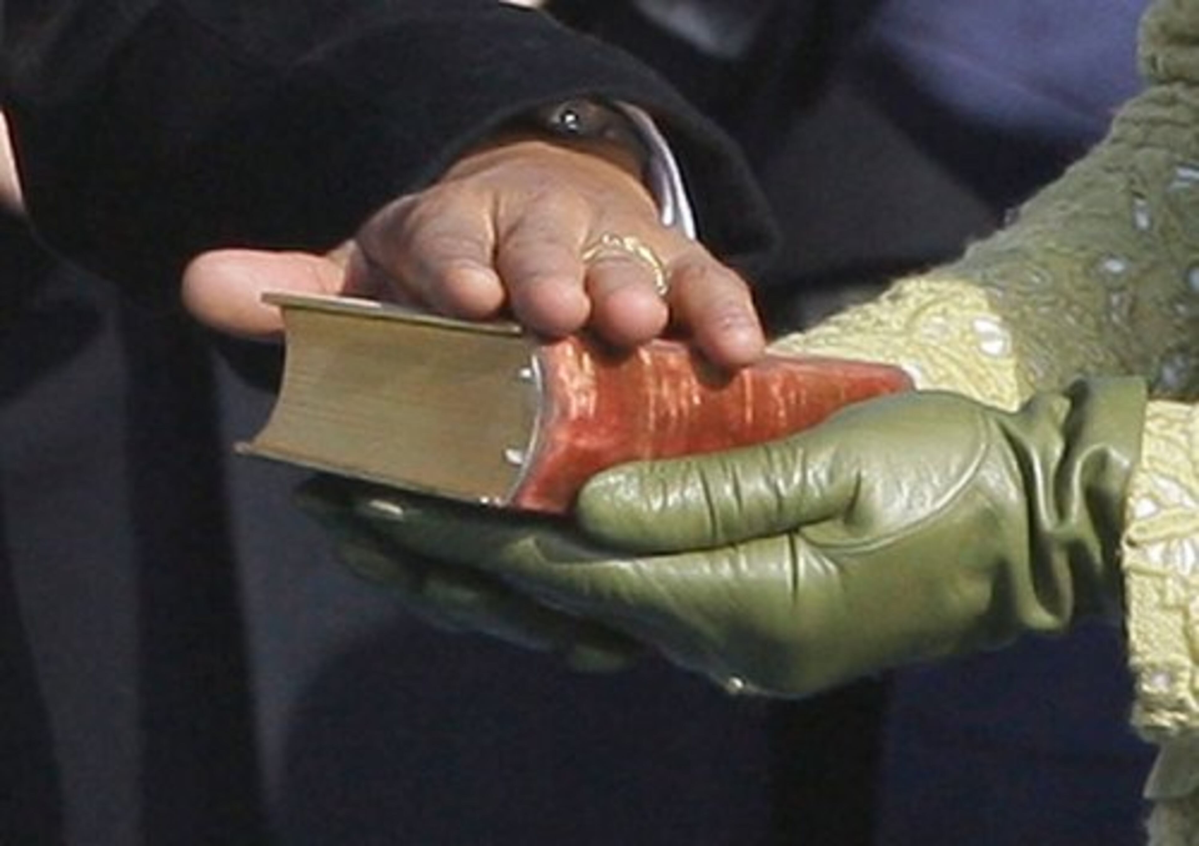 Michelle Obama holds President Lincoln's inaugural Bible as her husband takes the oath of office.