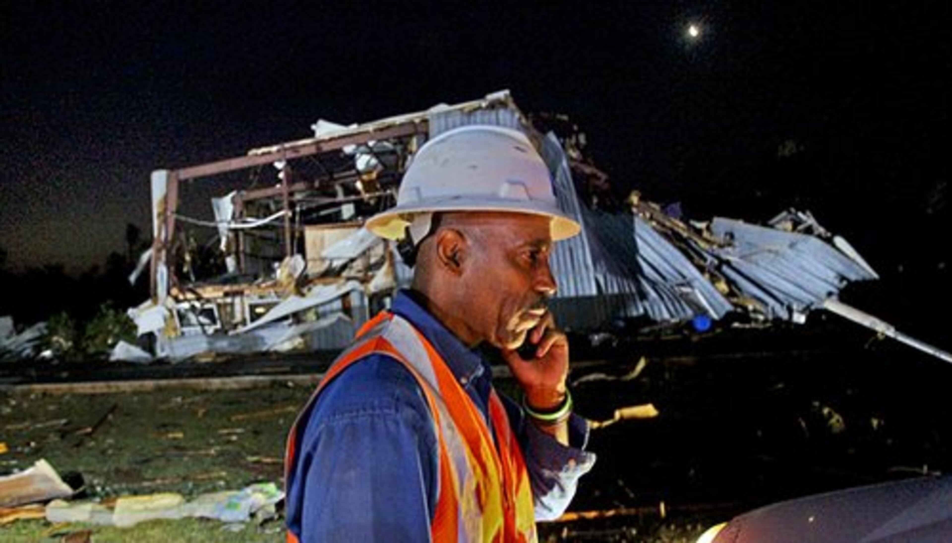 Atlanta Gas Light worker Ted Patterson assesses the situation in front of Atlanta Lift Salvage near School Road and US 19/41 Thursday, Apr. 28, 2011 in Sunny Side.