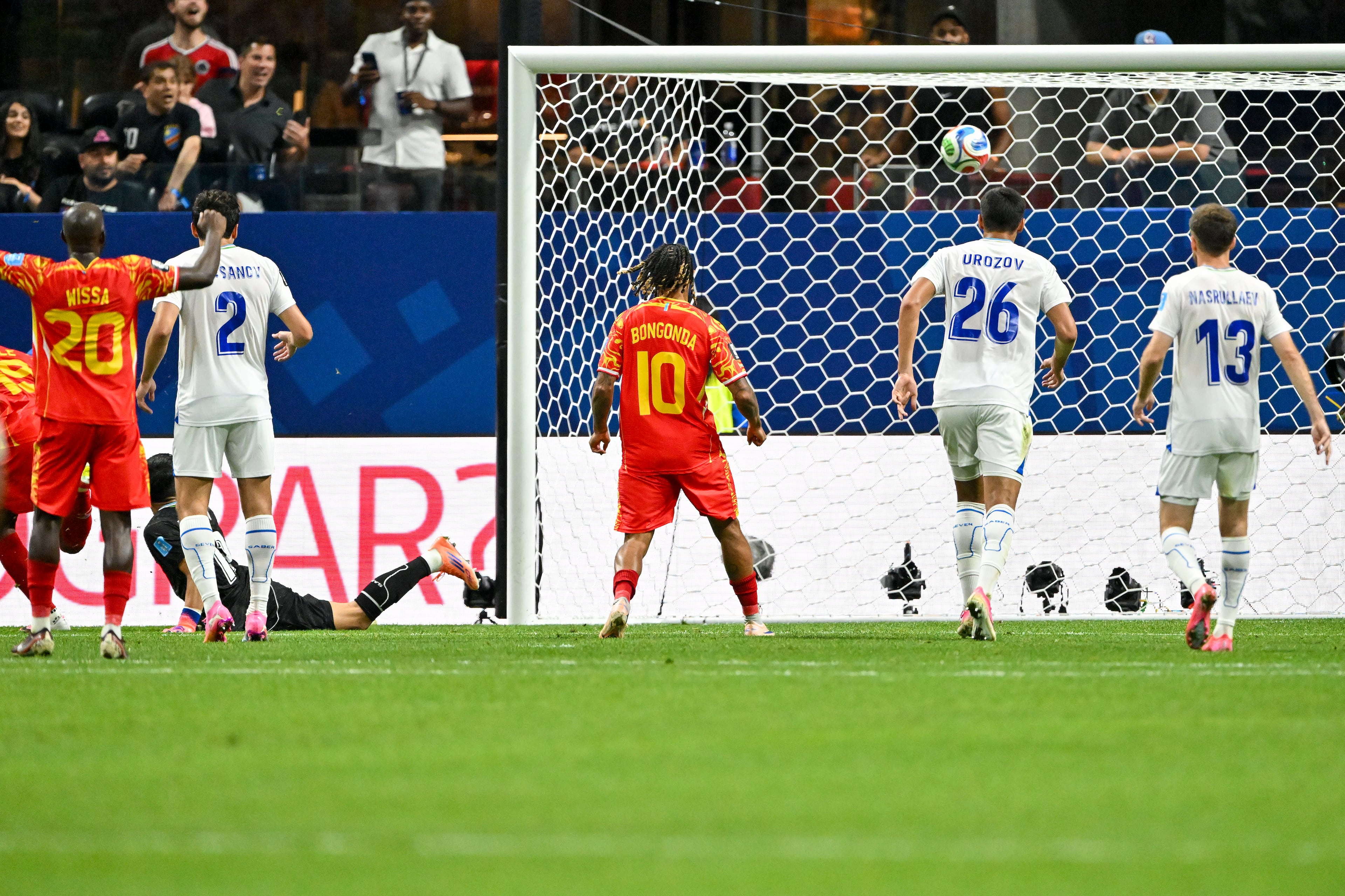 Congo forward Yoane Wissa (left) and forward Théo Bongonda (center) watch a goal by forward Fiston Mayele get past Uzbekistan goalkeeper Abduvohid Nematov during the second half of a FIFA World Cup match at Atlanta Stadium (Mercedes-Benz Stadium) on Saturday, June 27, 2026, in Atlanta. (Hyosub Shin/AJC)