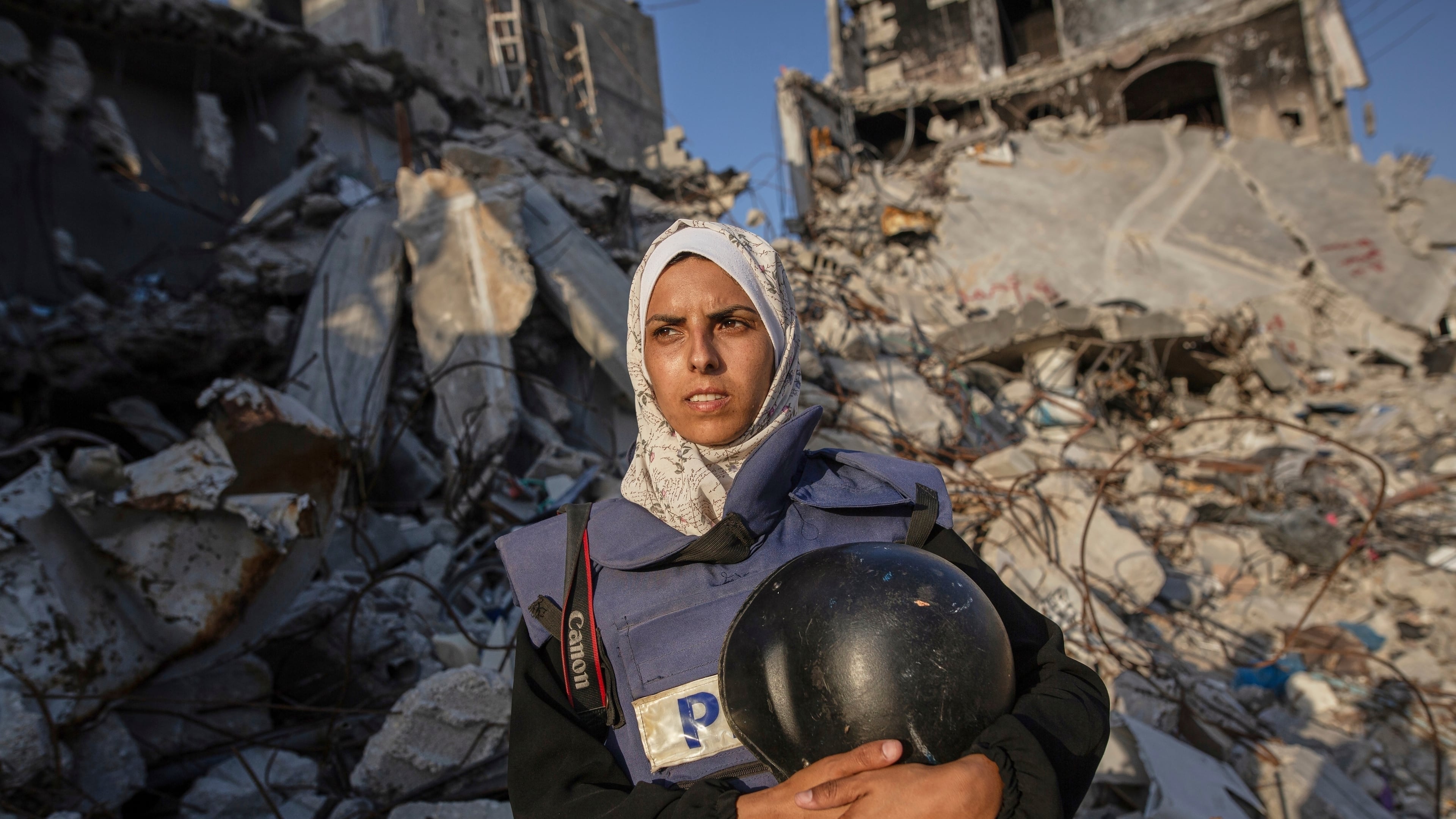FILE - Freelance journalist Mariam Dagga, 33, who had been working with the Associated Press and other outlets during the Gaza war, poses for a portrait in Khan Younis, southern Gaza Strip, on June 14, 2024. (AP Photo/Jehad Alshrafi, File)