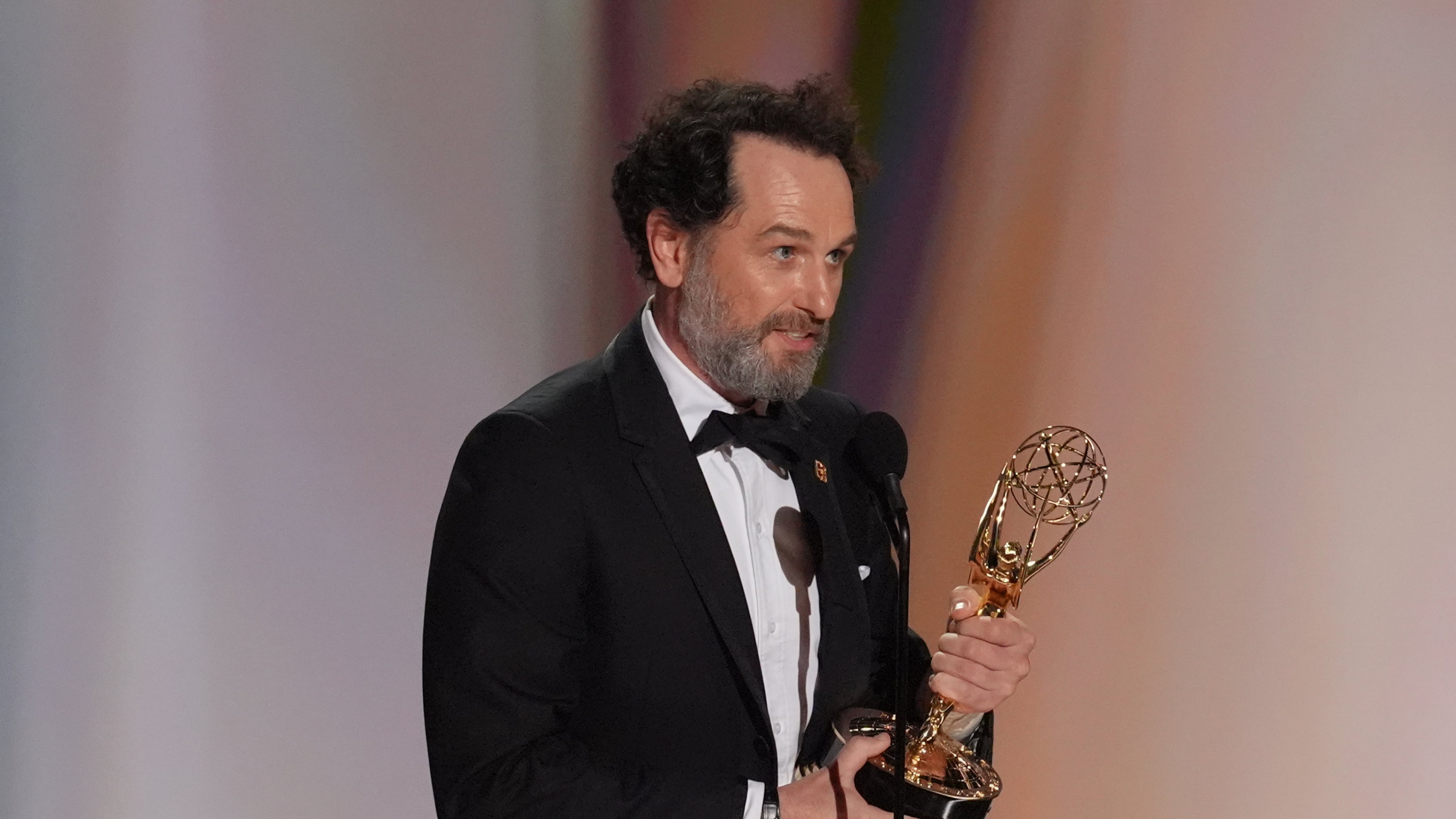 Matthew Rhys accepts the award for outstanding lead actor in a limited or anthology series or movie for "The Beast In Me" during the 78th Emmy Awards on Monday, Sept. 14, 2026, at the Peacock Theater in Los Angeles. (AP Photo/Chris Pizzello)