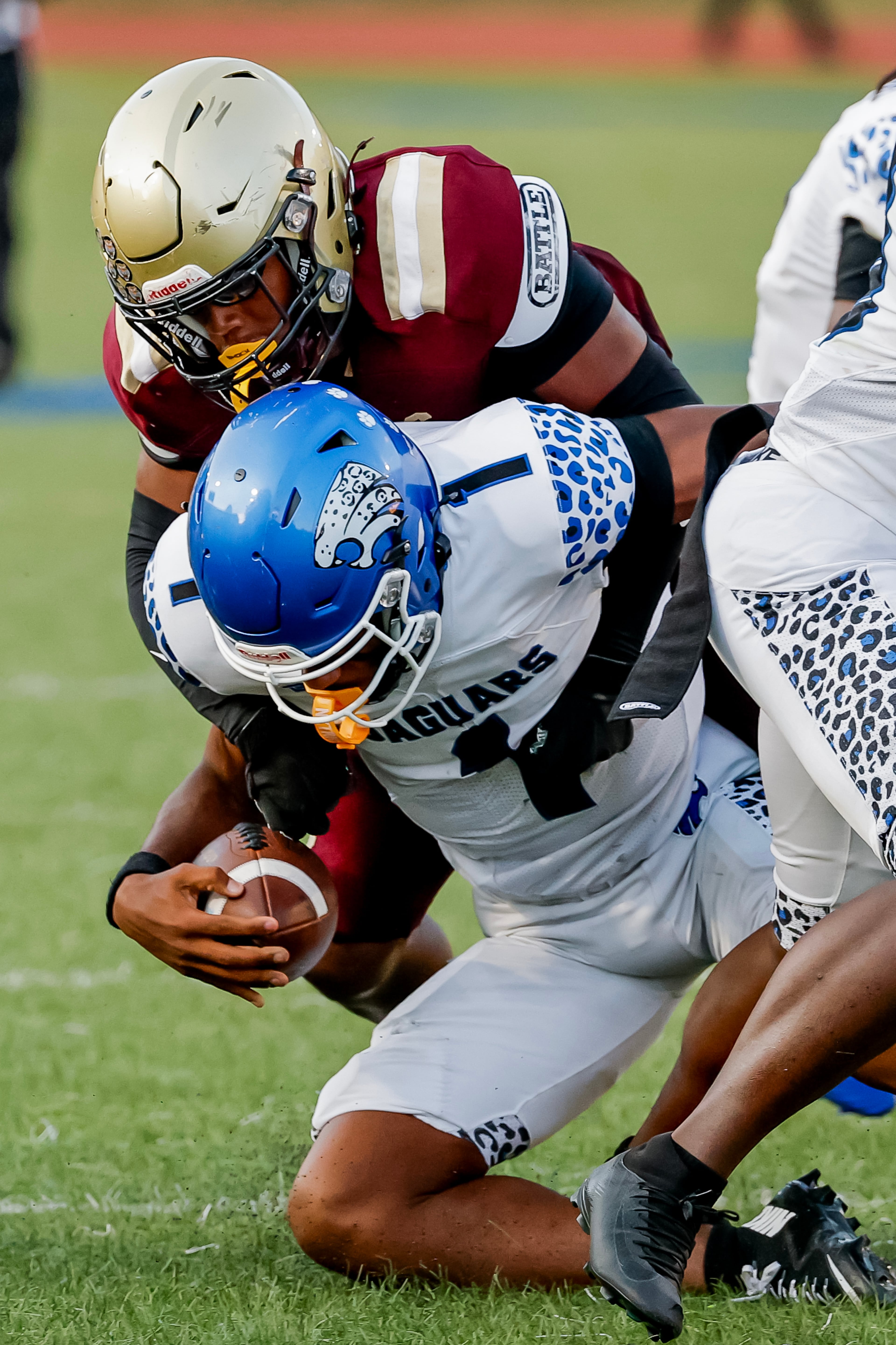 Stephenson quarterback Zabrian Boler (front) is sacked by Tucker defender Samuel Bryant during their game at Hallford Stadium on Friday, Sept. 4, 2026, in Clarkston. (Erik S. Lesser for the AJC)