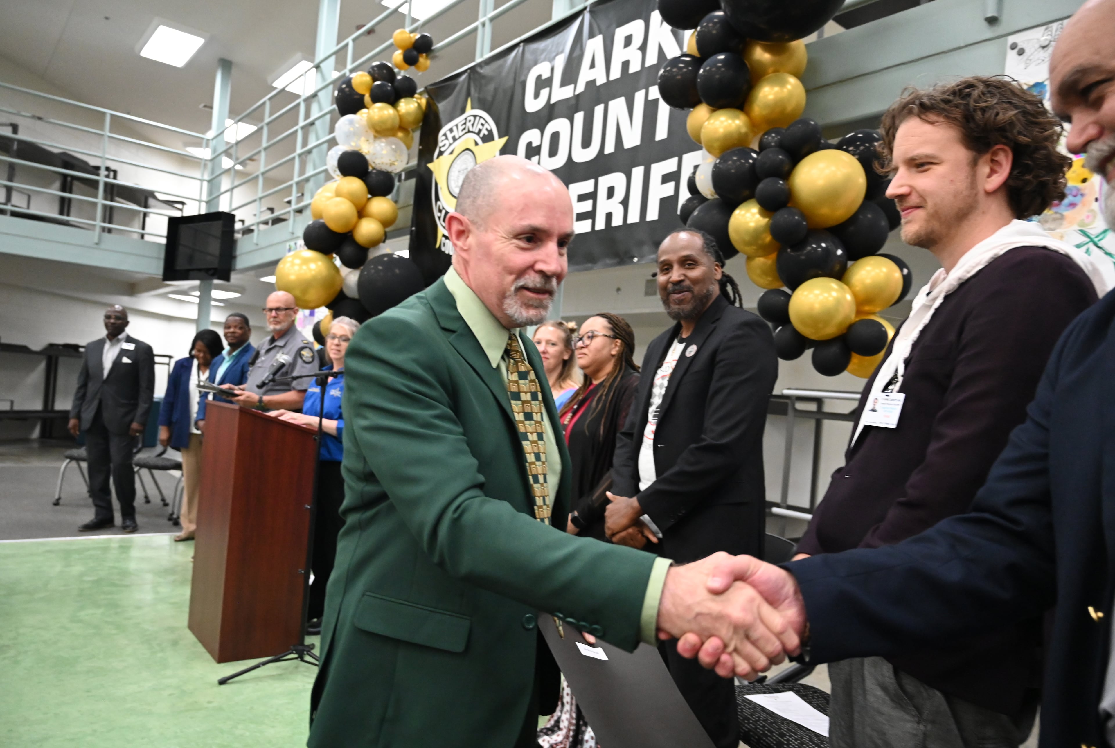 Kirby Kesler is congratulated by class instructors and volunteers after receiving his certificate during a graduation ceremony for the Re-Entry Success Program at the Athens-Clarke County Jail on Wednesday, June 18, 2025, in Athens. (Hyosub Shin/AJC)