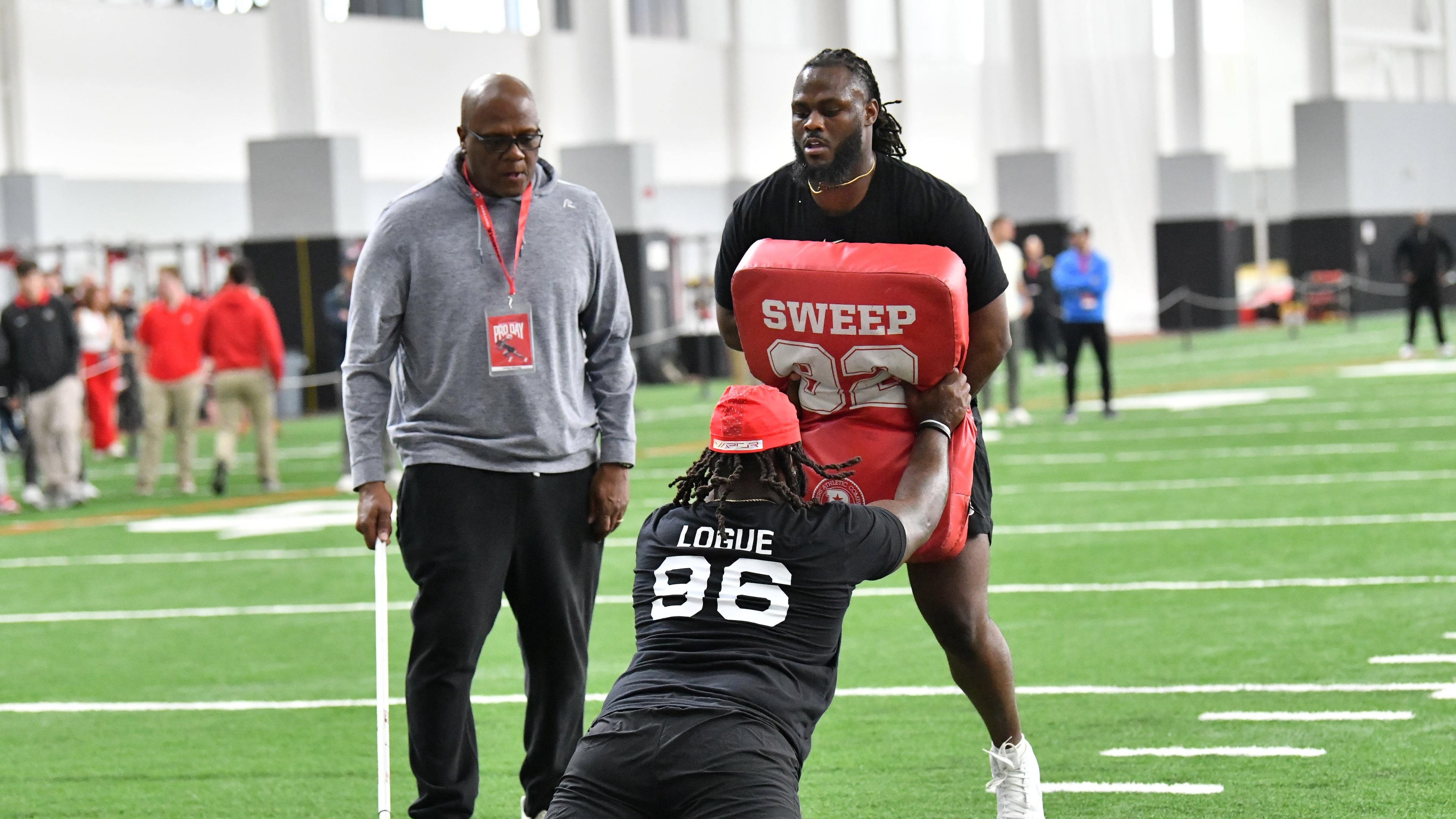 Georgia defensive lineman Zion Logue and Georgia defensive lineman Tramel Walthour team up to run football drills in front of coaches and scouts during Georgia Pro Day at Payne Indoor Athletic Facility, Wednesday, Mar. 13, 2024, in Athens. (Hyosub Shin / Hyosub.Shin@ajc.com)