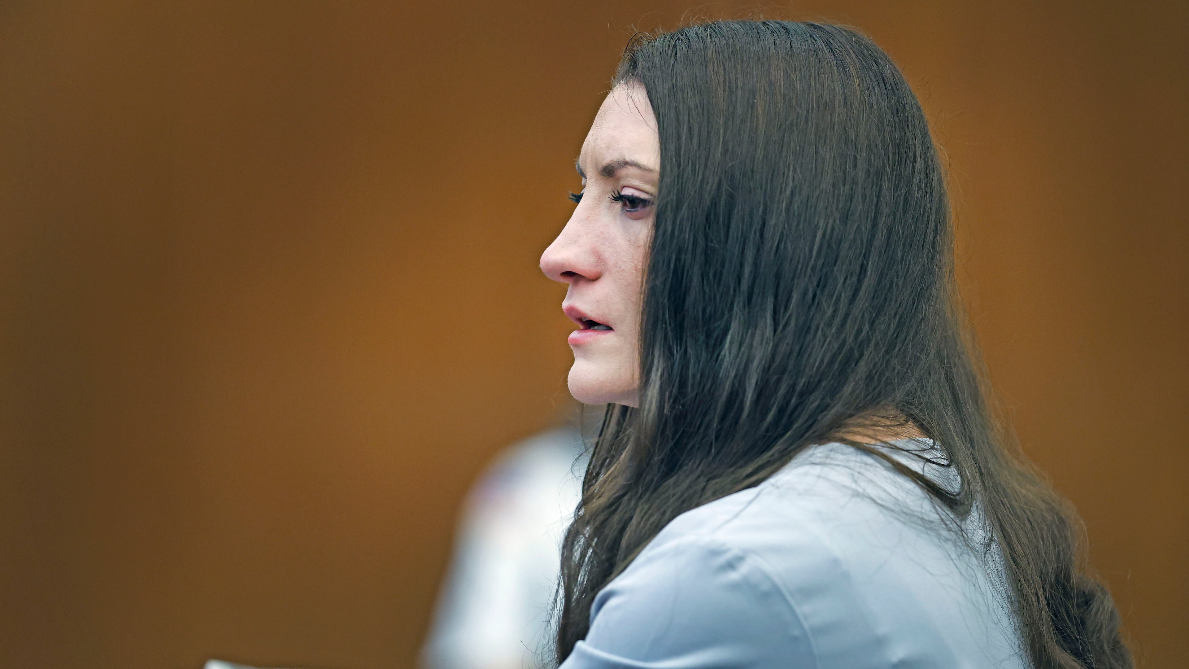 Lindsay Clancy tries to hold back tears as details of the murder of her three children are given in court during her murder trial at Plymouth Superior Court in Plymouth, Mass., Thursday, Aug. 27, 2026. (Greg Derr/The Patriot Ledger via AP, Pool)