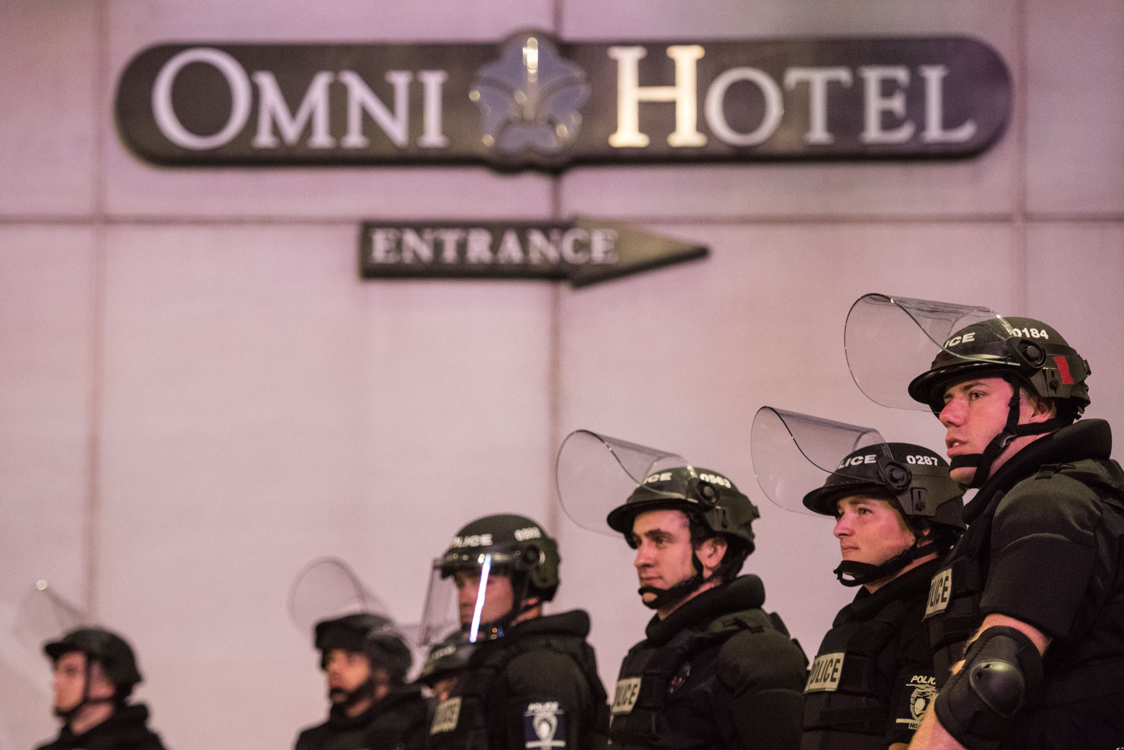 Police officers watch protests near the Omni Hotel September 22, 2016 in downtown Charlotte, NC. The North Carolina governor has declared a state of emergency in the city of Charlotte after clashes during protests in the city in response to the fatal shooting by police officers of 43-year-old Keith Lamont Scott at an apartment complex near UNC Charlotte. (Photo by Sean Rayford/Getty Images)