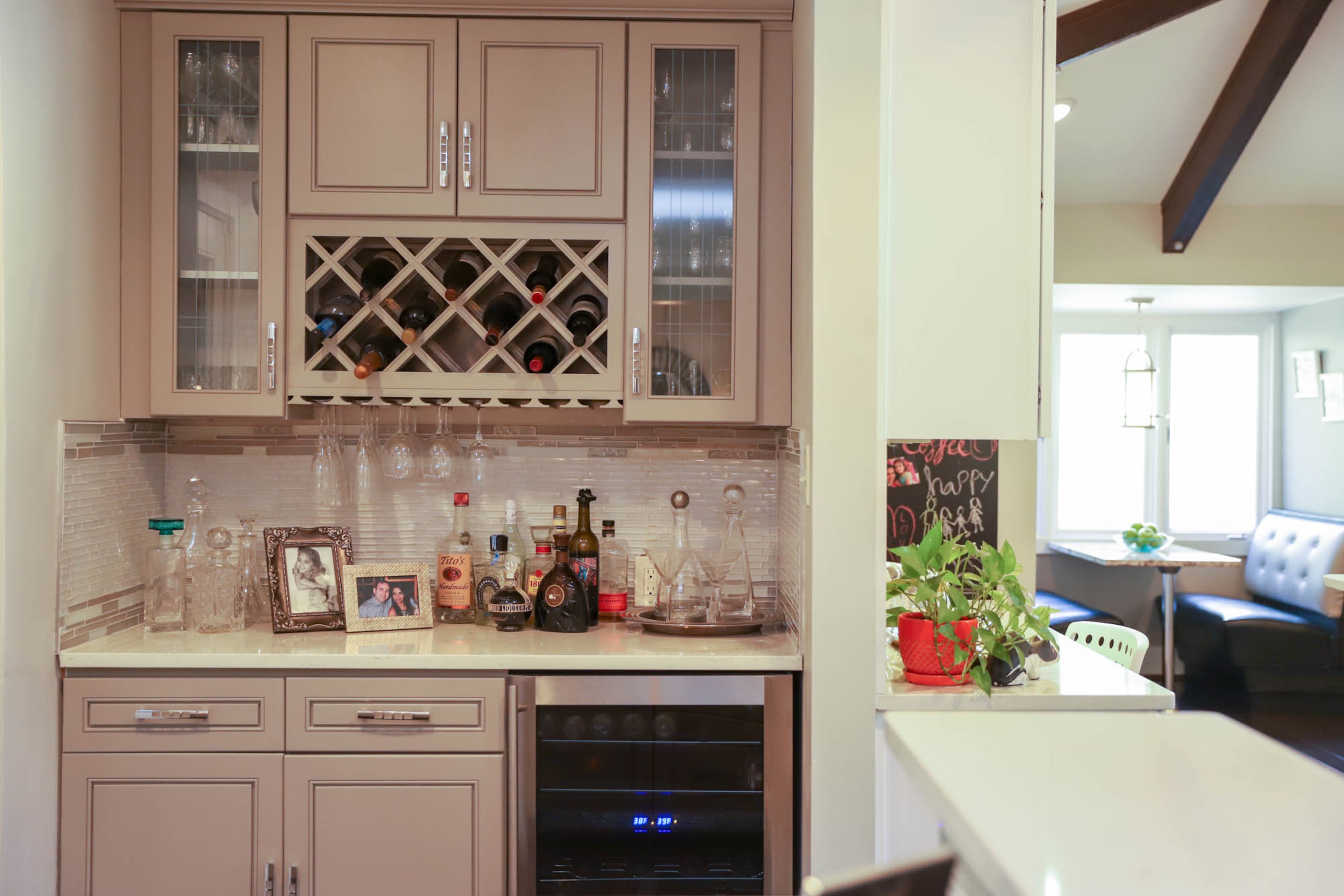 With an indoor pool and spa and a free-flowing floor plan that includes a custom bar added during the renovation, the Rosenhafts enjoy entertaining in their Sandy Springs home. Reynolds Rogers/FOR THE AJC