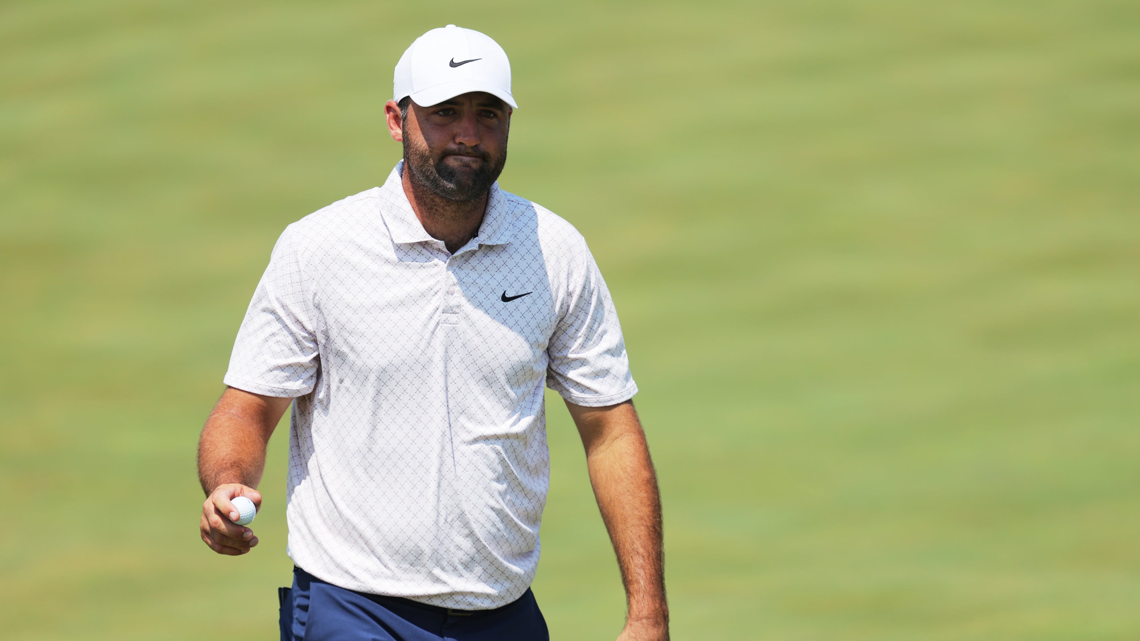 Scottie Scheffler reacts after his shot on the ninth green during the final round of the 3M Open golf tournament at the Tournament Players Club Sunday, July 26, 2026, in Blaine, Minn. (AP Photo/Bailey Hillesheim)