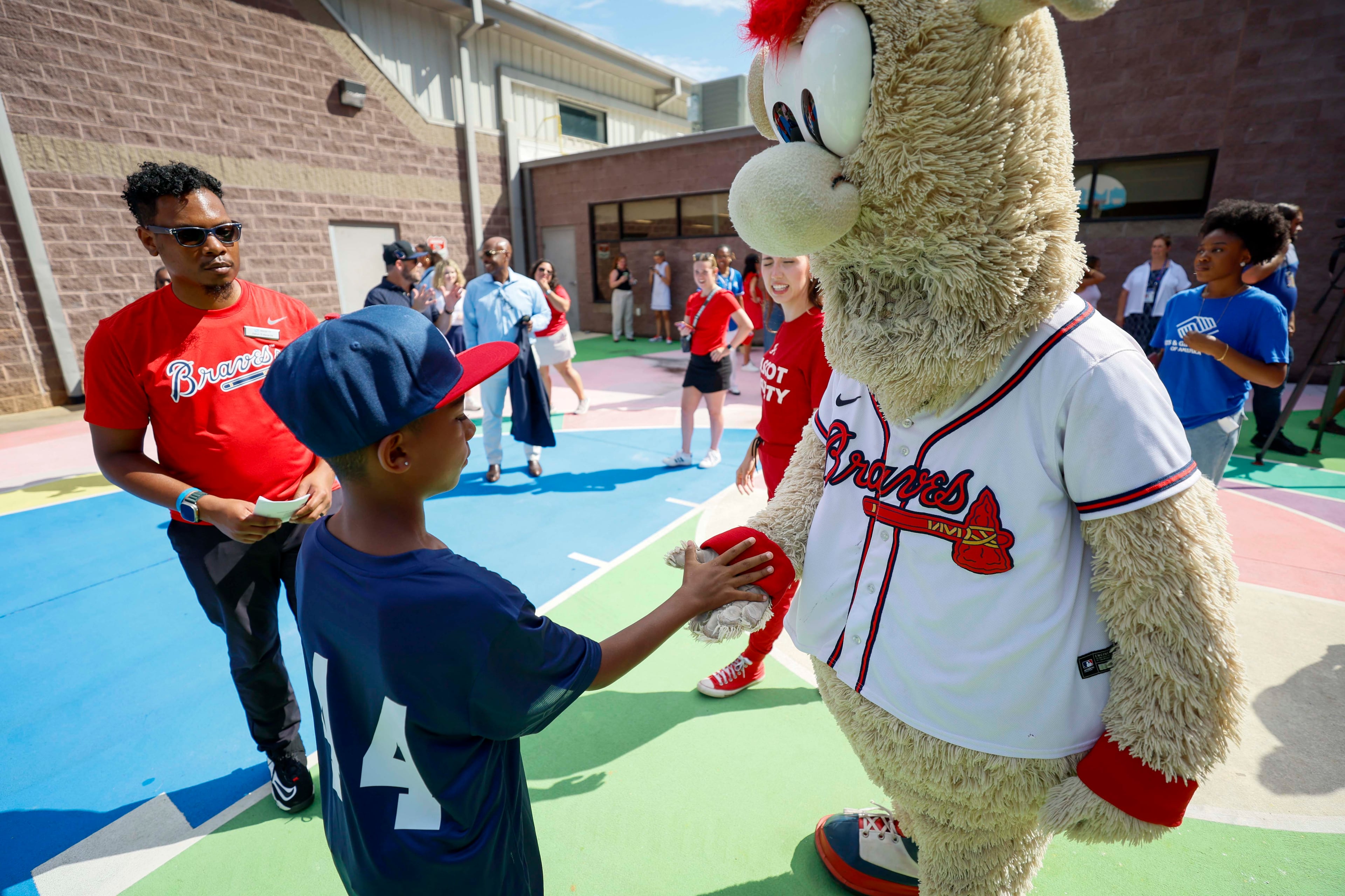 Atlanta Braves mascot The Blooper gives a high-five to a kid during the unveiling of the new All-Star Legacy Field at the Barksdale Boys & Girls Club in Conyers on Thursday, July 10, 2025. The event occurs during MLB All-Star Game week in Atlanta.
(Miguel Martinez/ AJC)