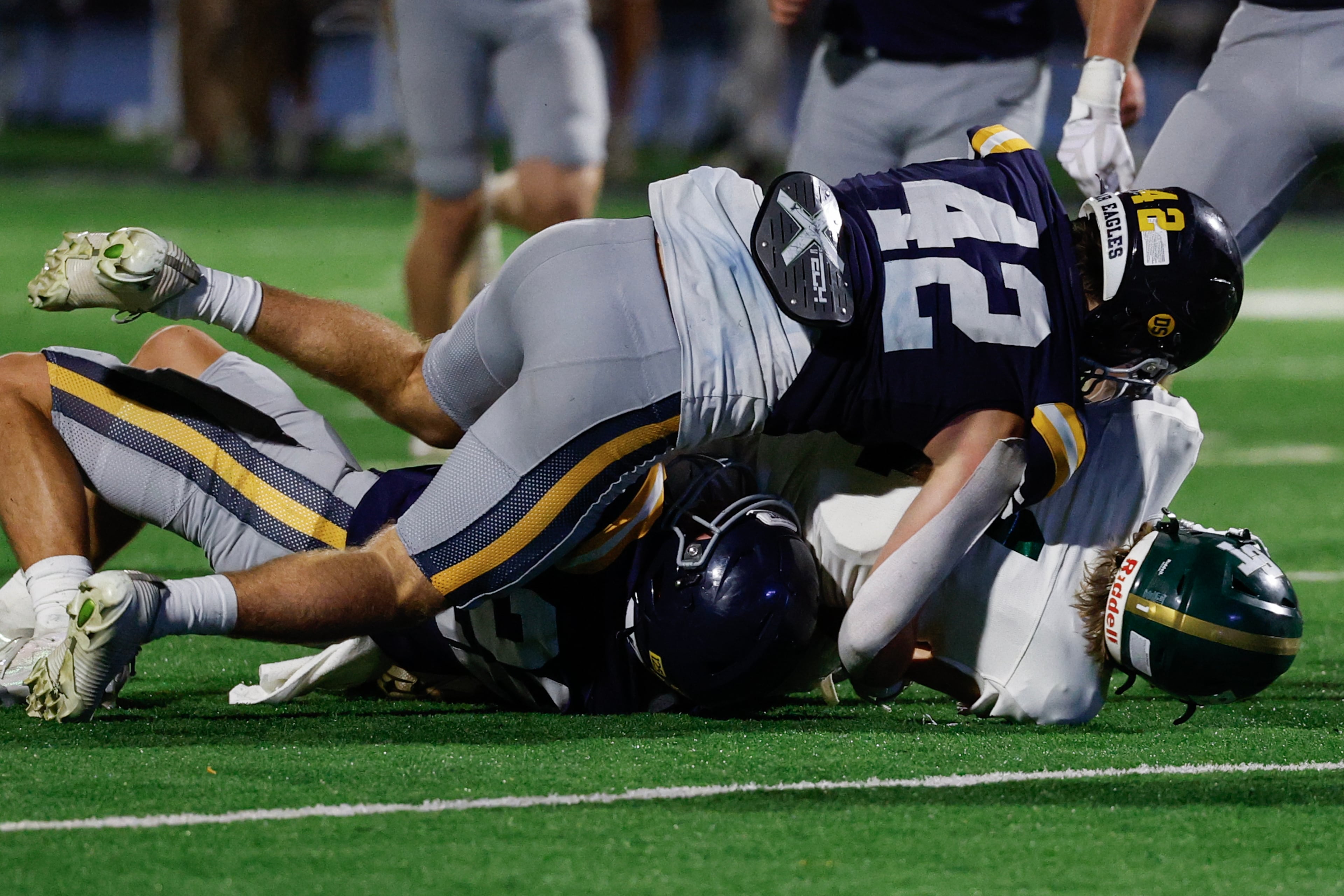 Marist's Owen Hare (42) tackles Blessed Trinity's Andrew Cochran (1) during the second half a high school football game between Blessed Trinity and Marist, Friday, Sept. 25, 2026, in Atlanta. (Erik S. Lesser for the AJC)
