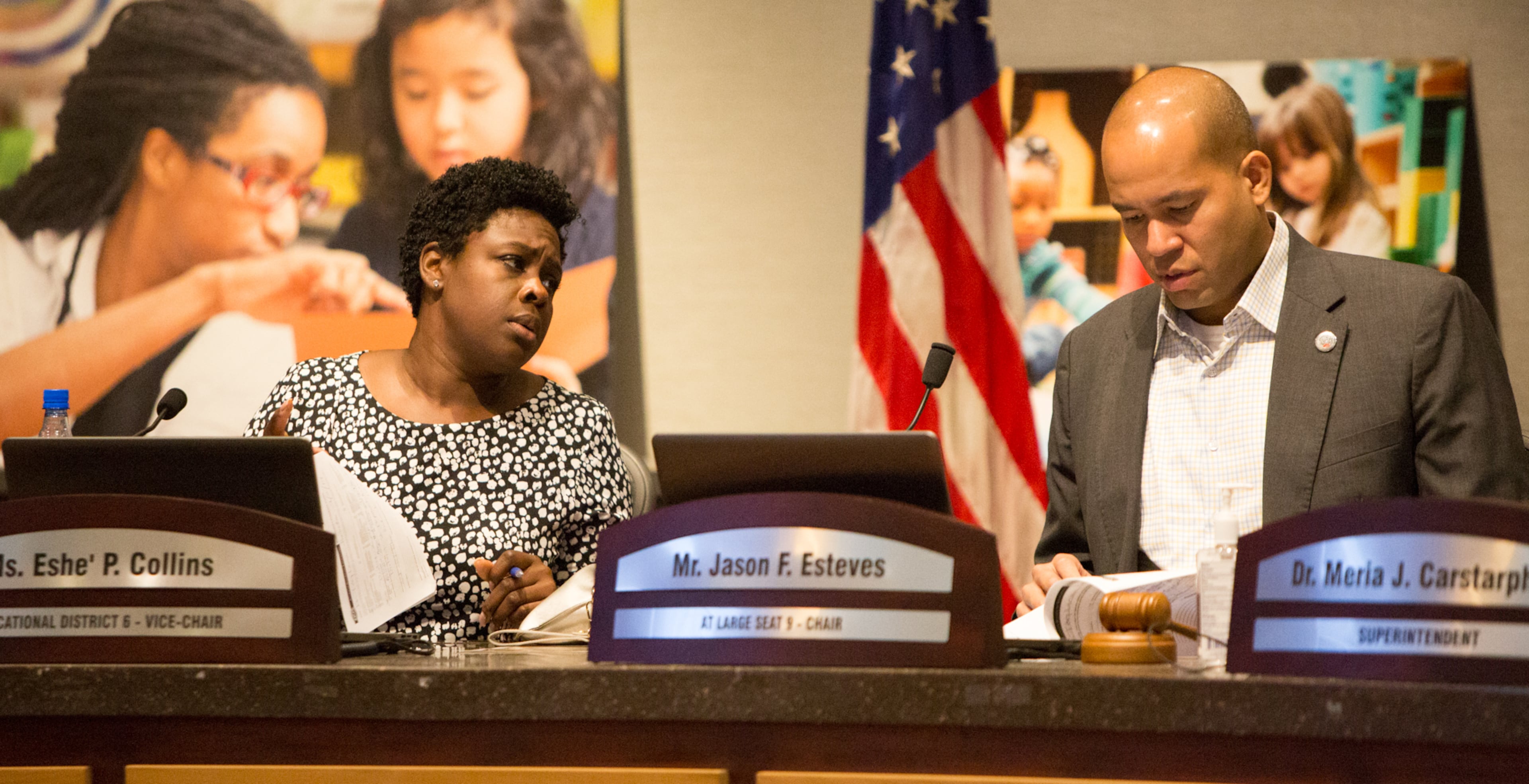 The Atlanta school board vice chair Eshe' Collins (left) and chairman Jason Esteves chat before a special meeting on Monday, Sept. 9, 2019, to discuss whether to extend superintendent Meria Carstarphen's contract. (Photo by Phil Skinner).