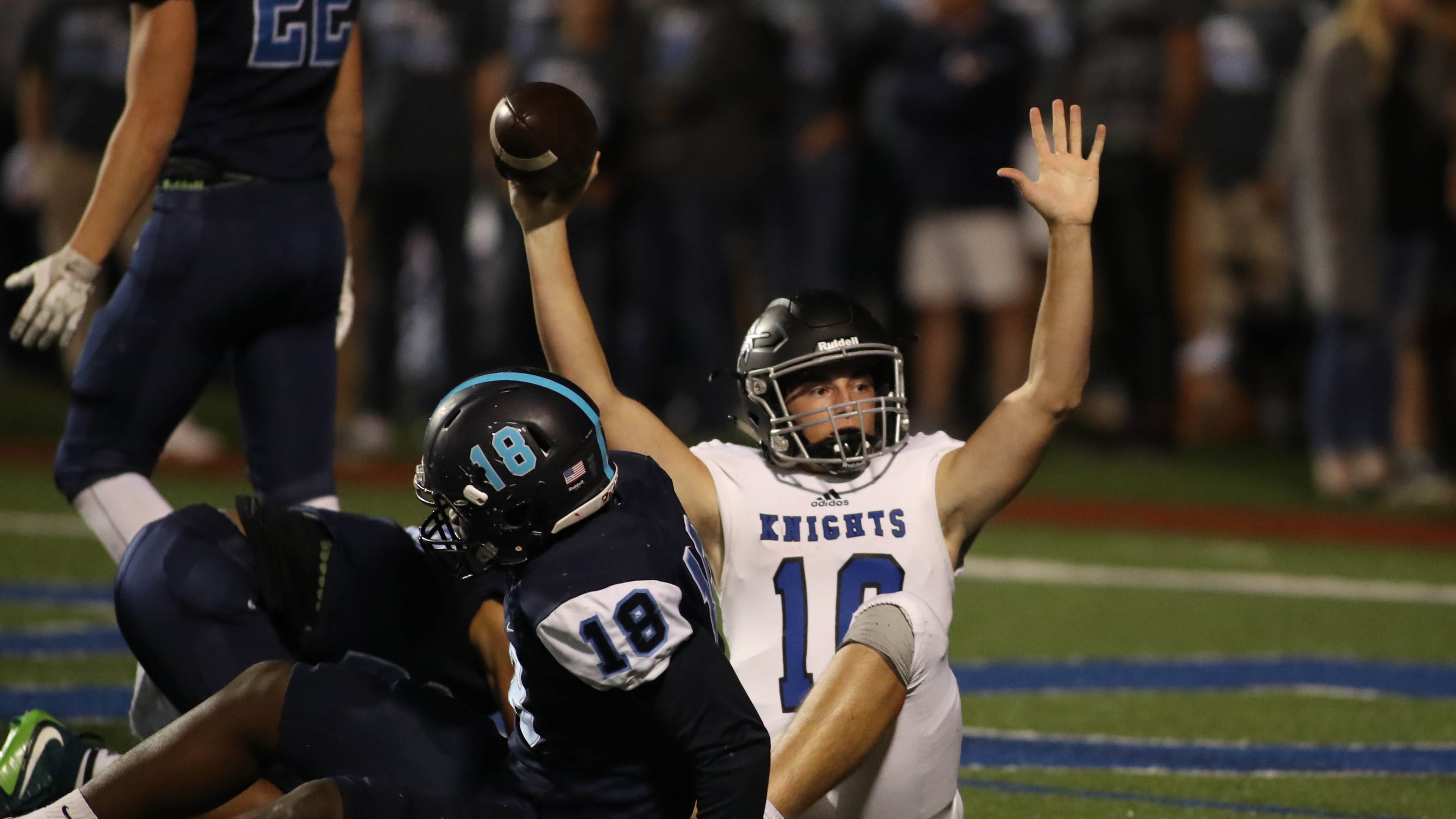 Centennial quarterback Max Brosmer (center) — pictured celebrating a rushing touchdown against Pope in October 2017 — will make his first NFL start today for the Vikings. Minnesota takes on the Seattle Seahawks, who are coached by another Centennial graduate, Mike Macdonald. (Jason Getz/AJC 2017)