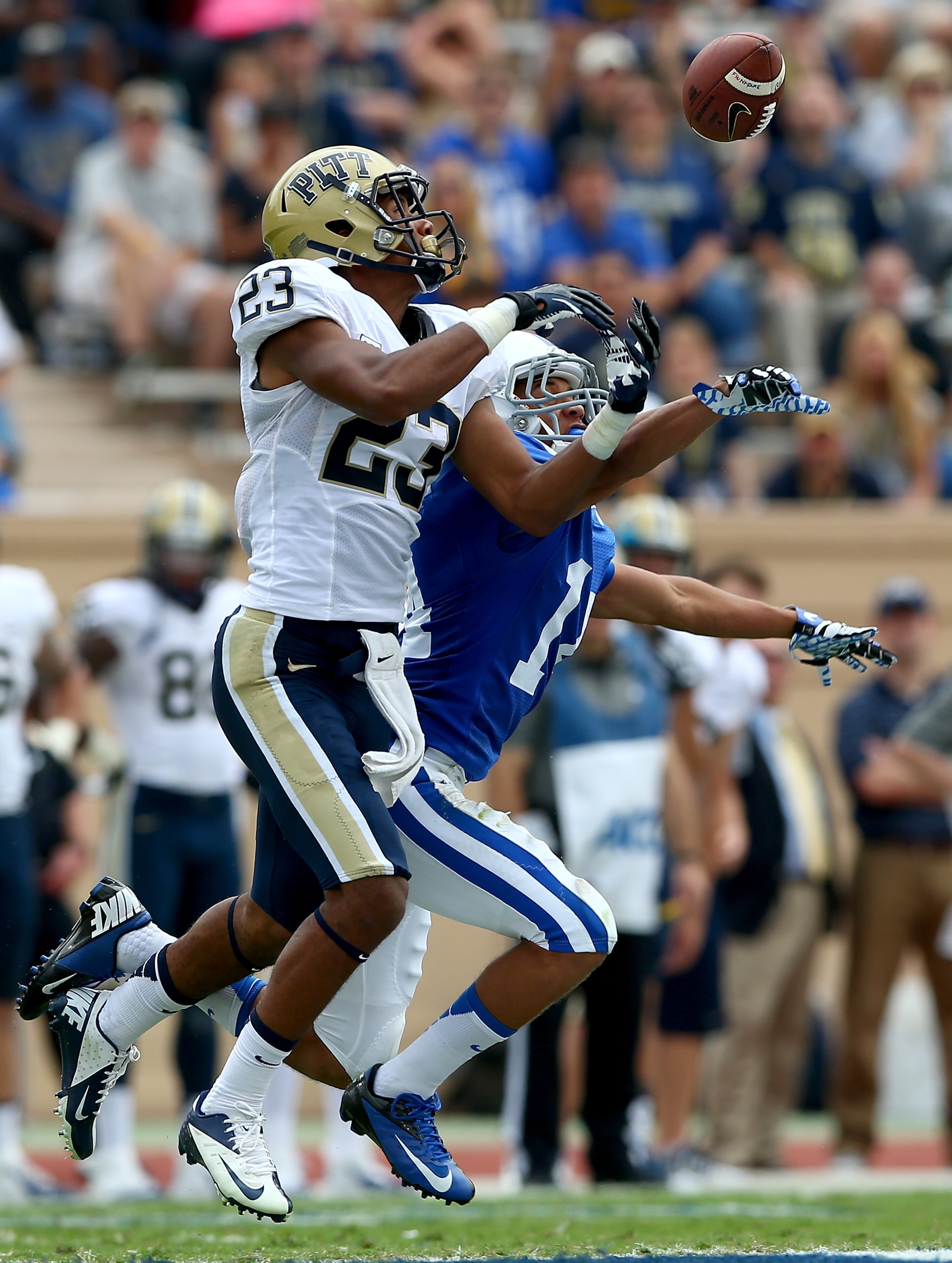 Bryon Fields (14) of the Duke Blue Devils battles for a ball with Tyler Boyd (23) of the Pittsburgh Panthers during their game at Wallace Wade Stadium on September 21, 2013 in Durham, North Carolina. (Photo by Streeter Lecka/Getty Images)