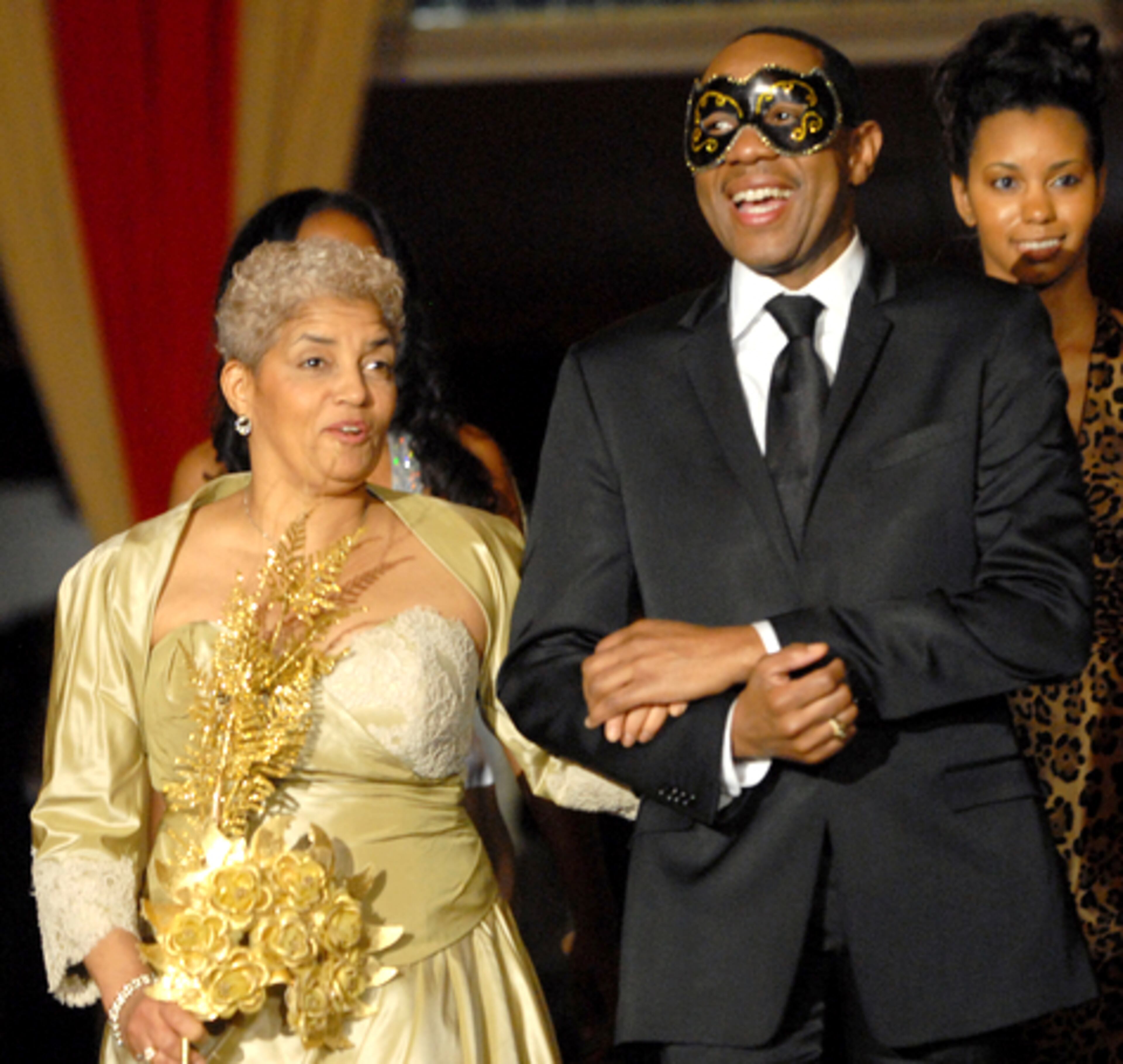 Atlanta Mayor Shirley Franklin is escorted into the ballroom by national R&B recording artist Freddie Jackson. The 24th annual Mayor's Masked Ball was held Saturday evening at the Hilton downtown.