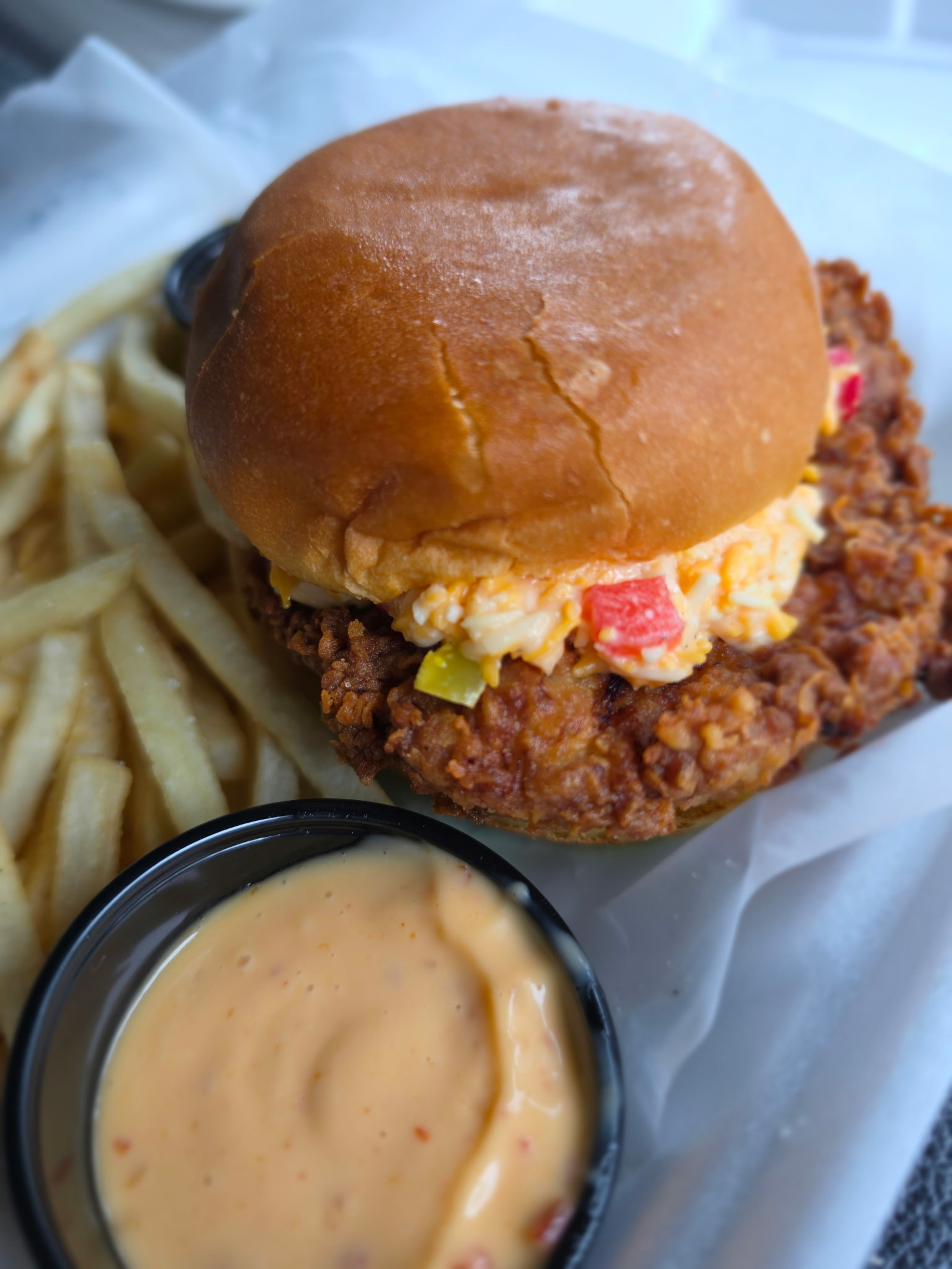 The Wilkes fried pork chop sandwich at Dive Southern Coastal Kitchen. (Justin Brown for the AJC)