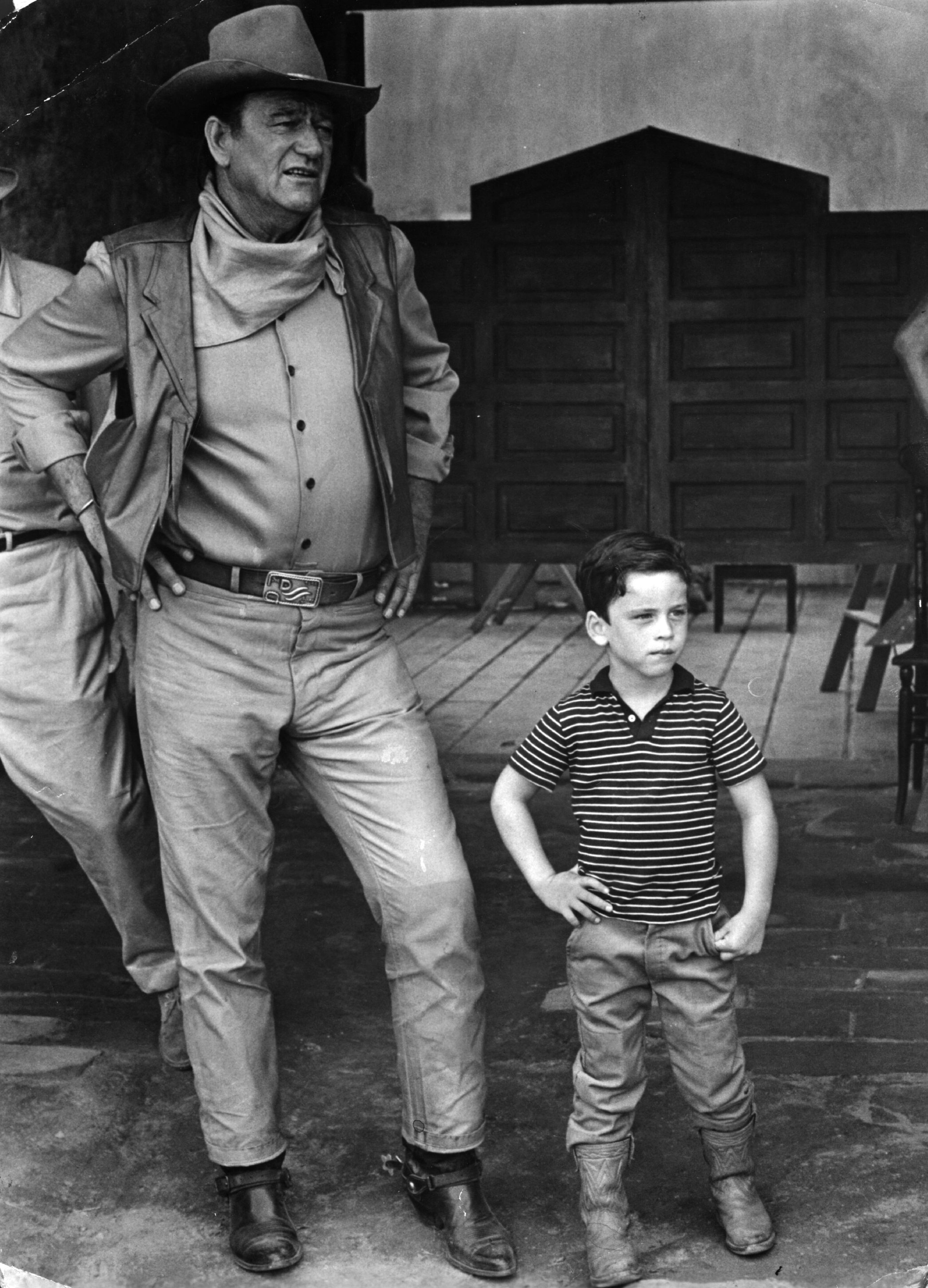 Film star John Wayne, with his son, on location in Mexico for the filming of "War Wagon" in 1967.