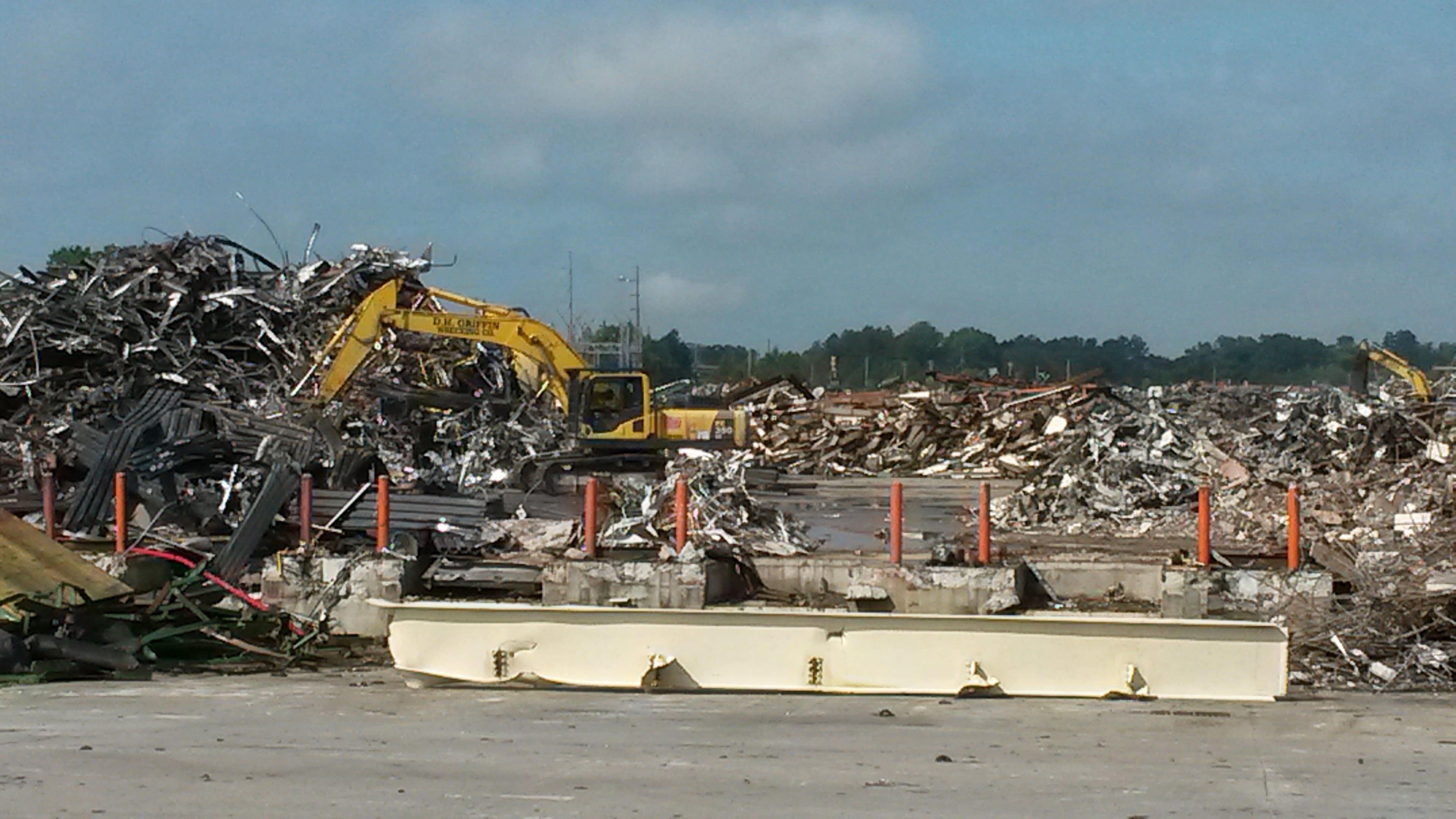 Towering piles of scrap rise almost as high as some of the former buildings they once were at GM's closed assembly plant in Doraville. MATT KEMPNER / AJC