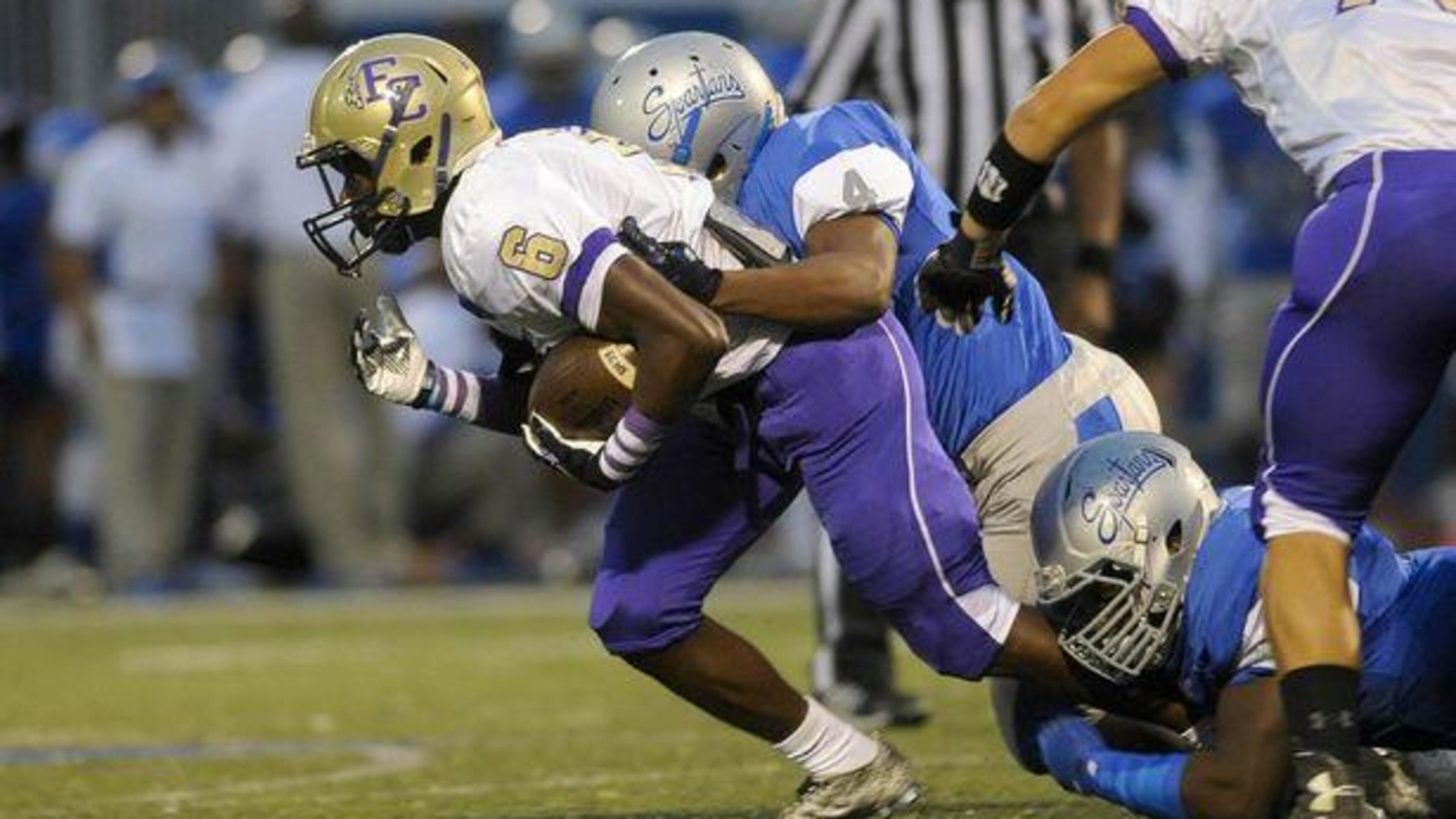 Smyrna, Ga. —Campbell High linebacker Kobe Palmer (4) takes down East Coweta junior Devonte Brown (6) in the first quarter of play at Cambell’s McDaniel Stadium Friday, September 25, 2015. Special/Daniel Varnado