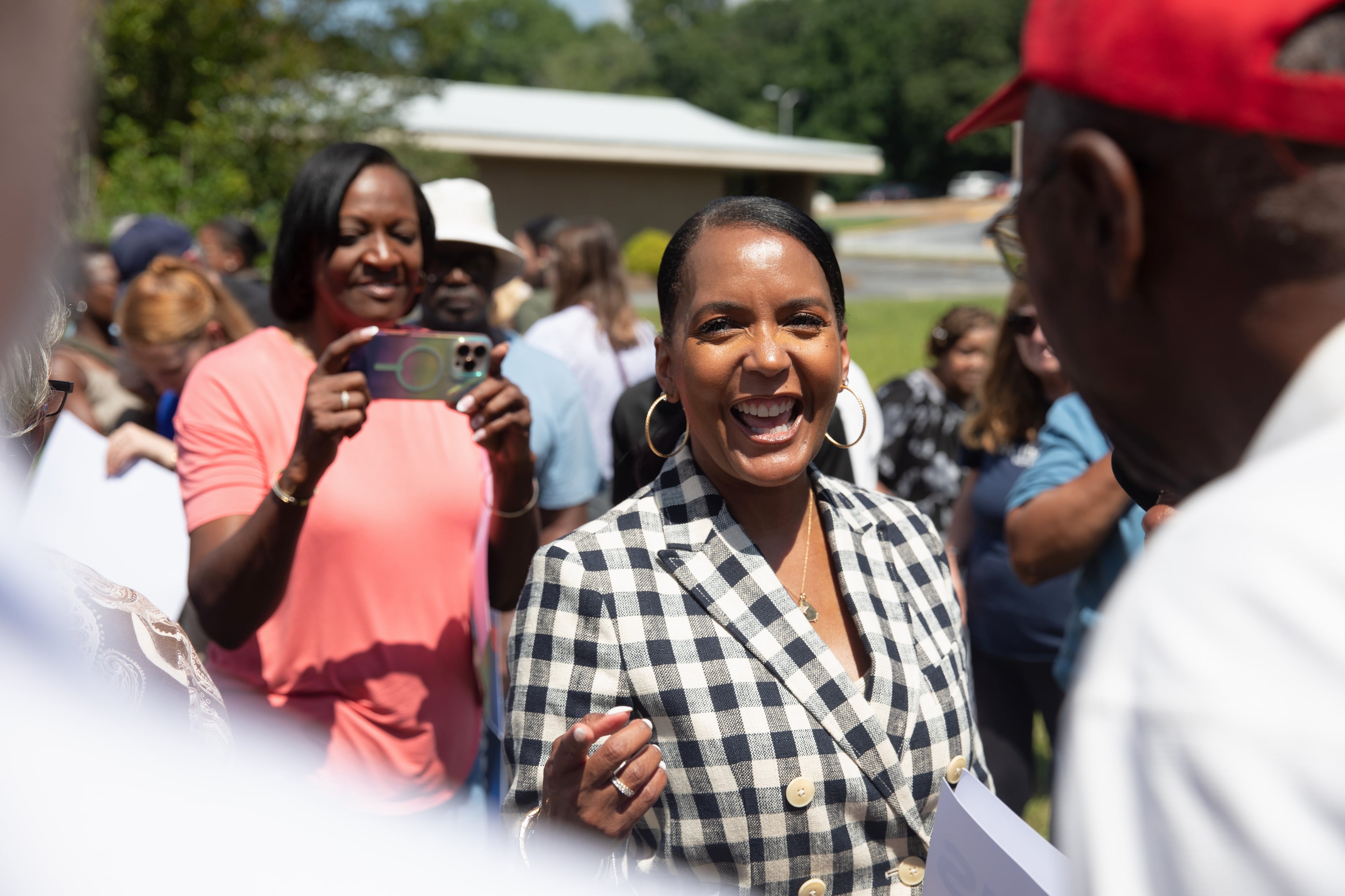 Former Atlanta mayor Keisha Lance Bottoms, the Democratic nominee for governor, campaigns outside of a shuttered rural hospital in Commerce on Wednesday. (Riley Bunch/AJC)