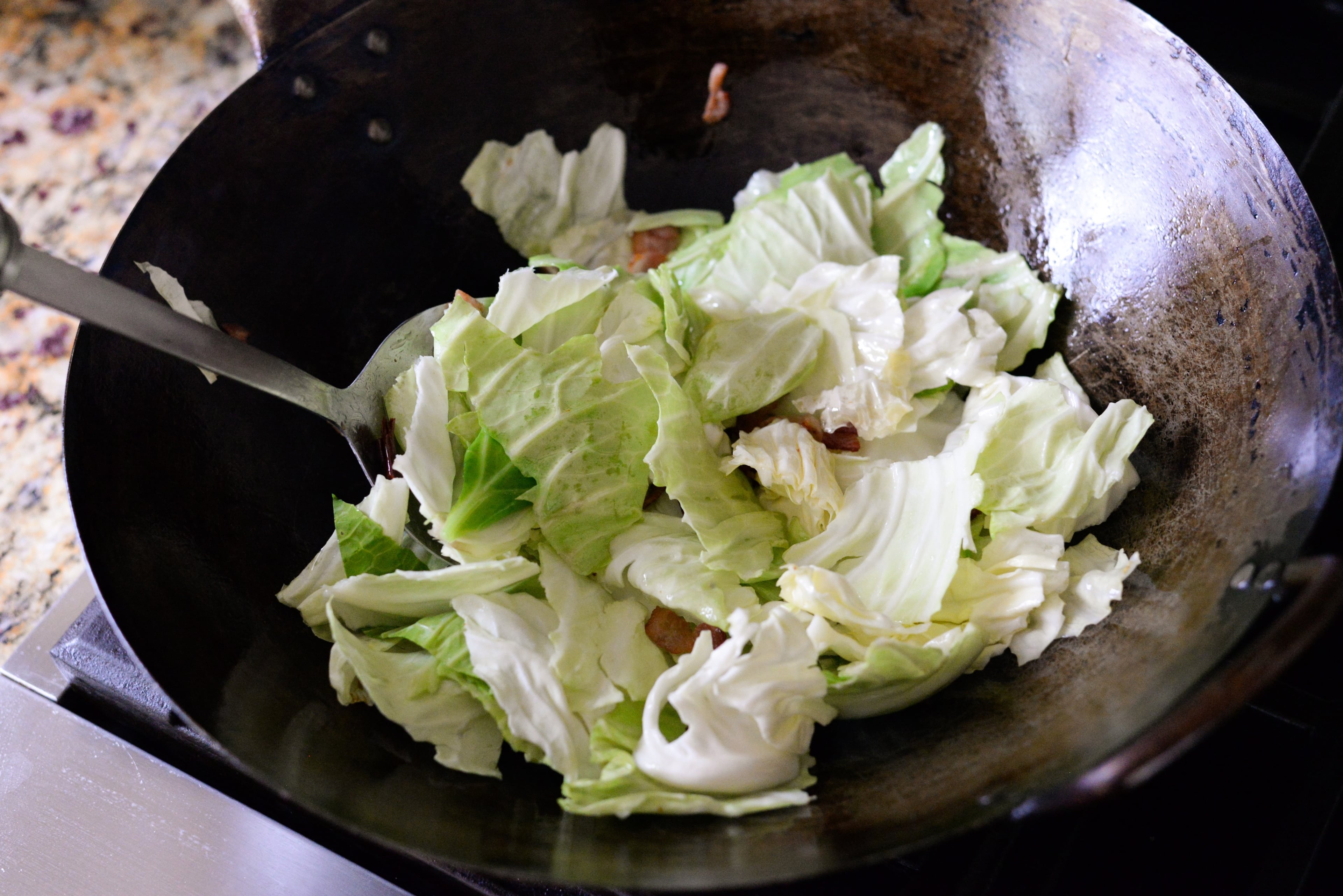 Step 3: Reduce the heat to medium-high. Add the cabbage and stir-fry for 2-4 minutes. (Candy Hom for the AJC)