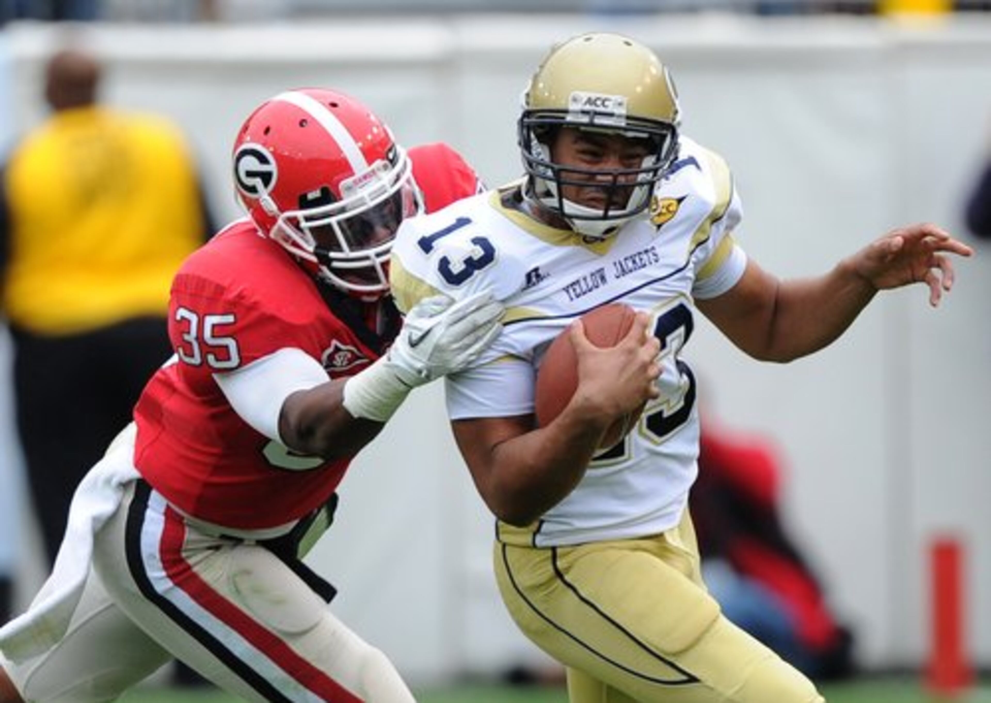 UGA's Michael Gilliard grabs Georgia Tech's Tevin Washington from behind. The Yellow Jackets quarterback threw two interceptions through the third quarter and was replaced in the fourth by Synjyn Days.