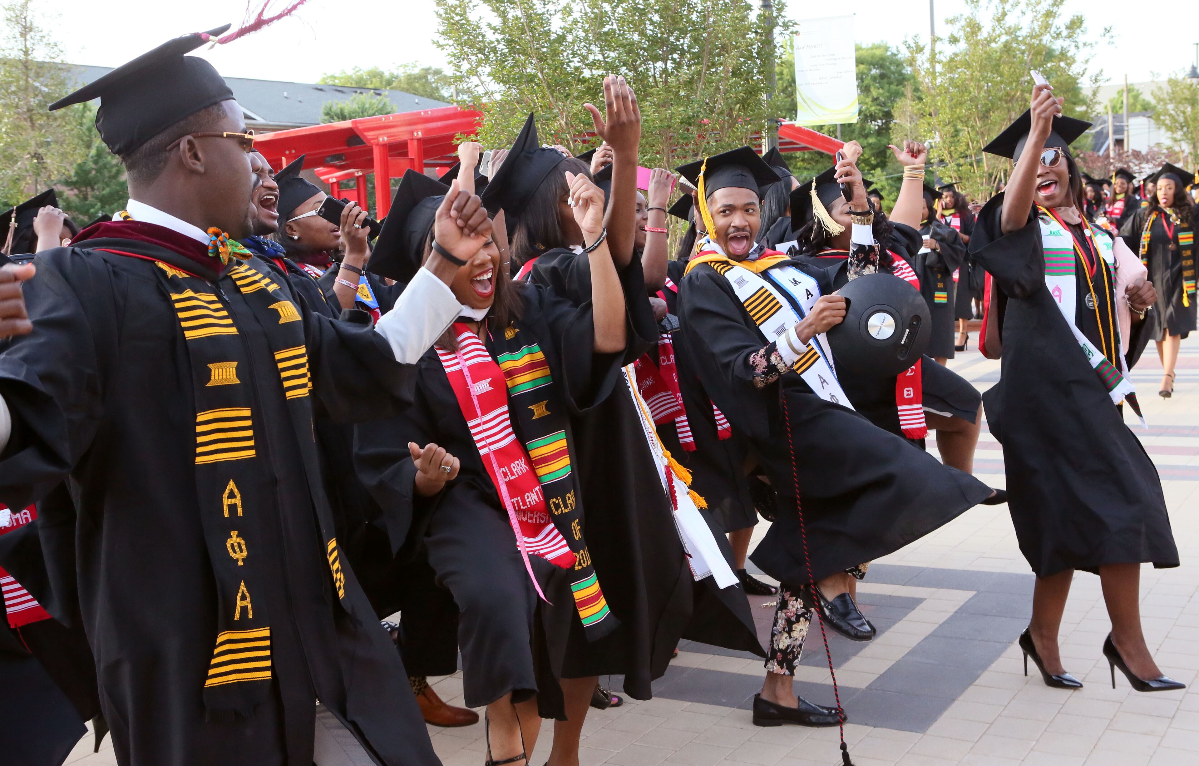 May 16, 2016 - Atlanta - Graduates celebrate as they line up for the processional. Clark Atlanta University class of 2016 filled Panther Stadium Monday morning for it's 27th annual Commencement Service. The keynote speaker was retired astronaut Mae Jemison, the first woman of color in Space. Honorary degrees were awarded to Hamilton Bohannon, a 1964 graduate of Clark College; Roland Carter; Congressman John Conyers, and Congressman Hank Johnson, a 1976 Clark College graduate. BOB ANDRES / BANDRES@AJC.COM