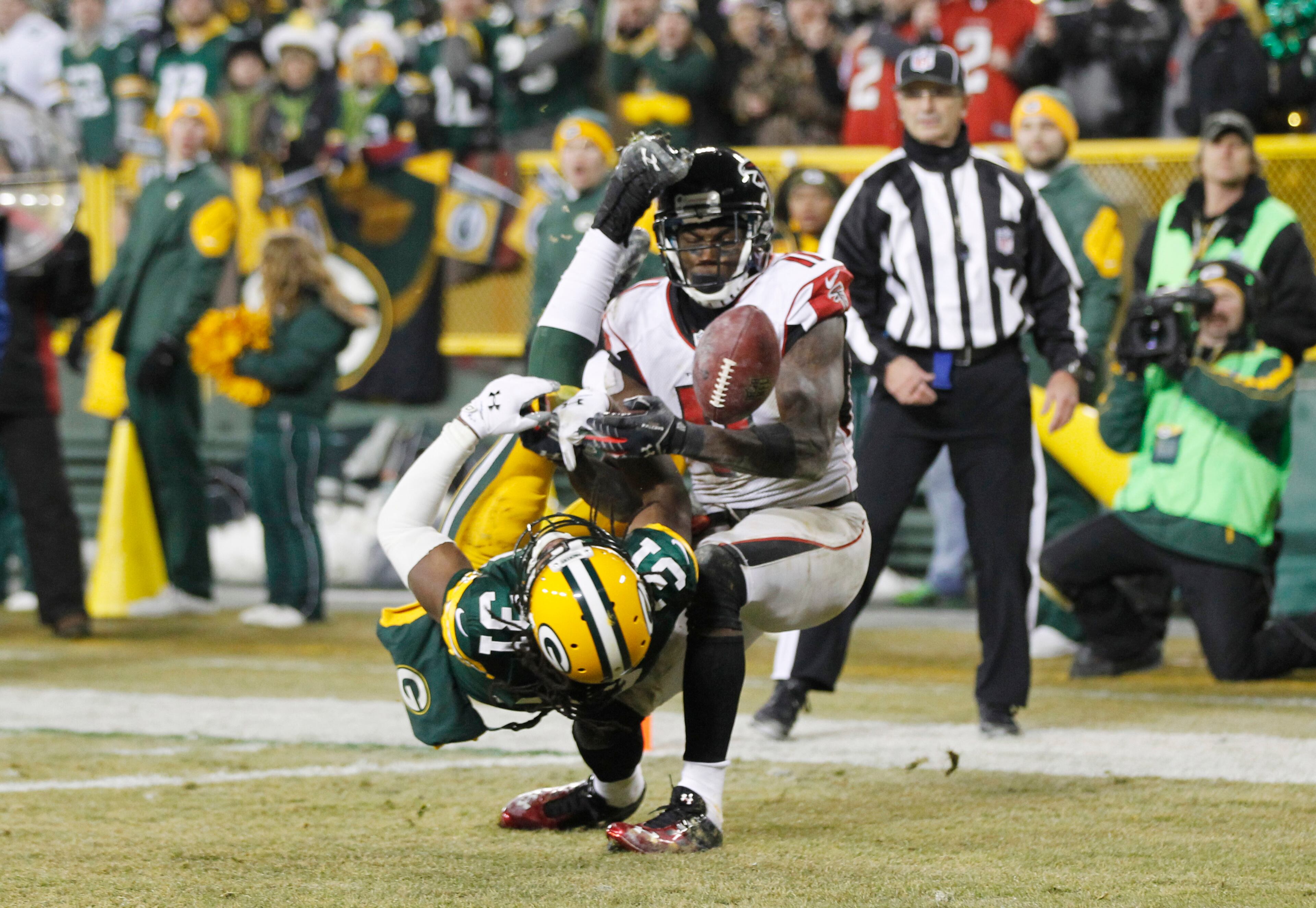 Green Bay Packers' Davon House breaks up a pass intended for Atlanta Falcons' Julio Jones during the second half Monday, Dec. 8, 2014, in Green Bay, Wis. Jones left the game with an injury late in the fourth quarter.