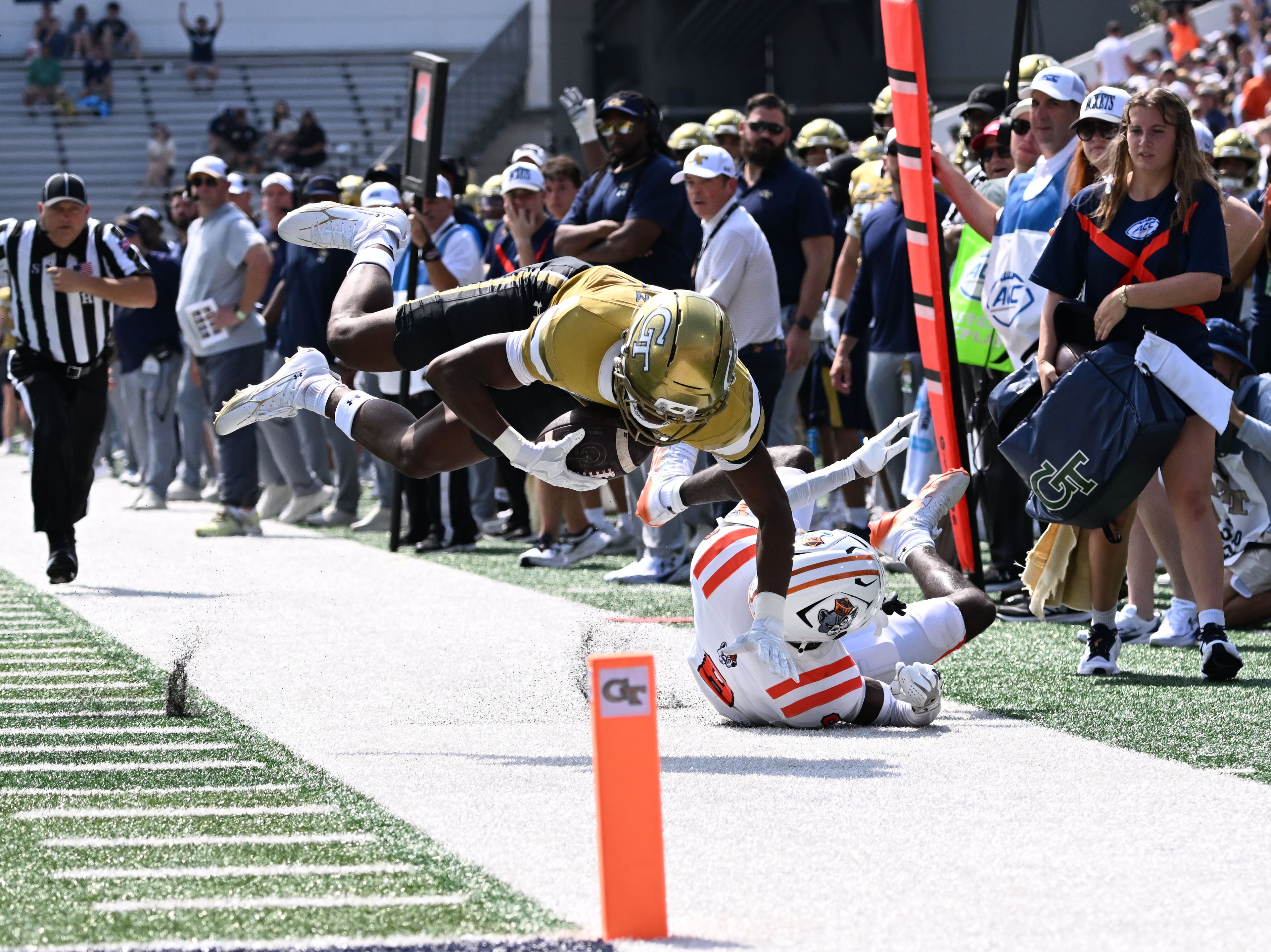 Georgia Tech wide receiver Dalen Penson (7) leaps over Mercer cornerback Cameron Goggins (8) after a catch during the first half in an NCAA college football game at Bobby Dodd Stadium on Saturday, Sept. 19, 2026, in Atlanta. (Hyosub Shin/AJC)