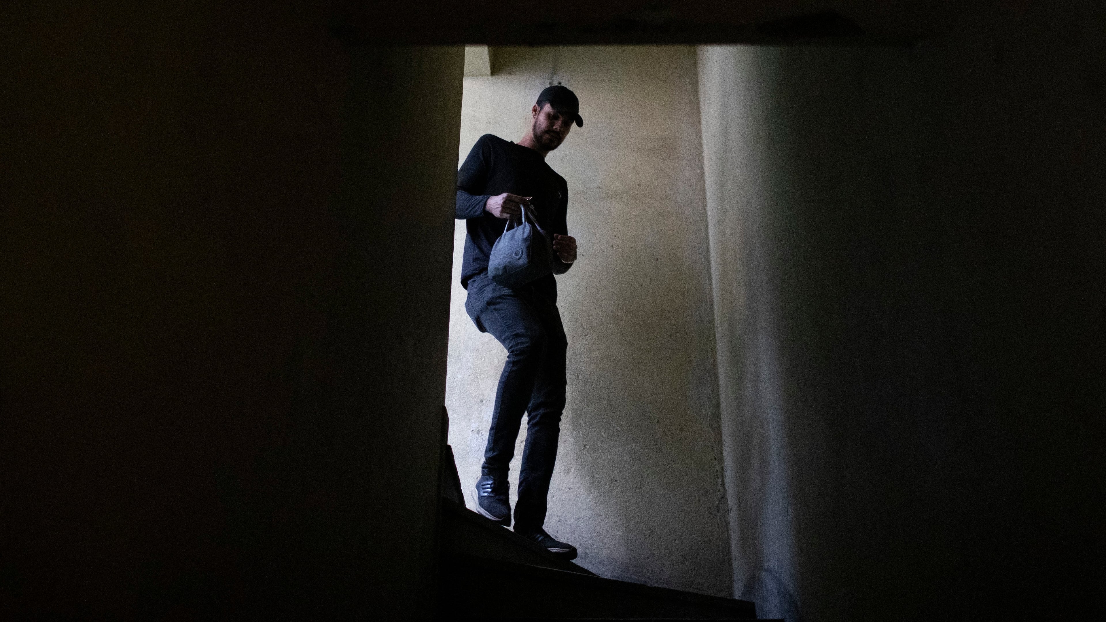 Matheus Paulo da Costa Silva leaves home for work in Rio de Janeiro, Friday, May 29, 2026. (AP Photo/Bruna Prado)