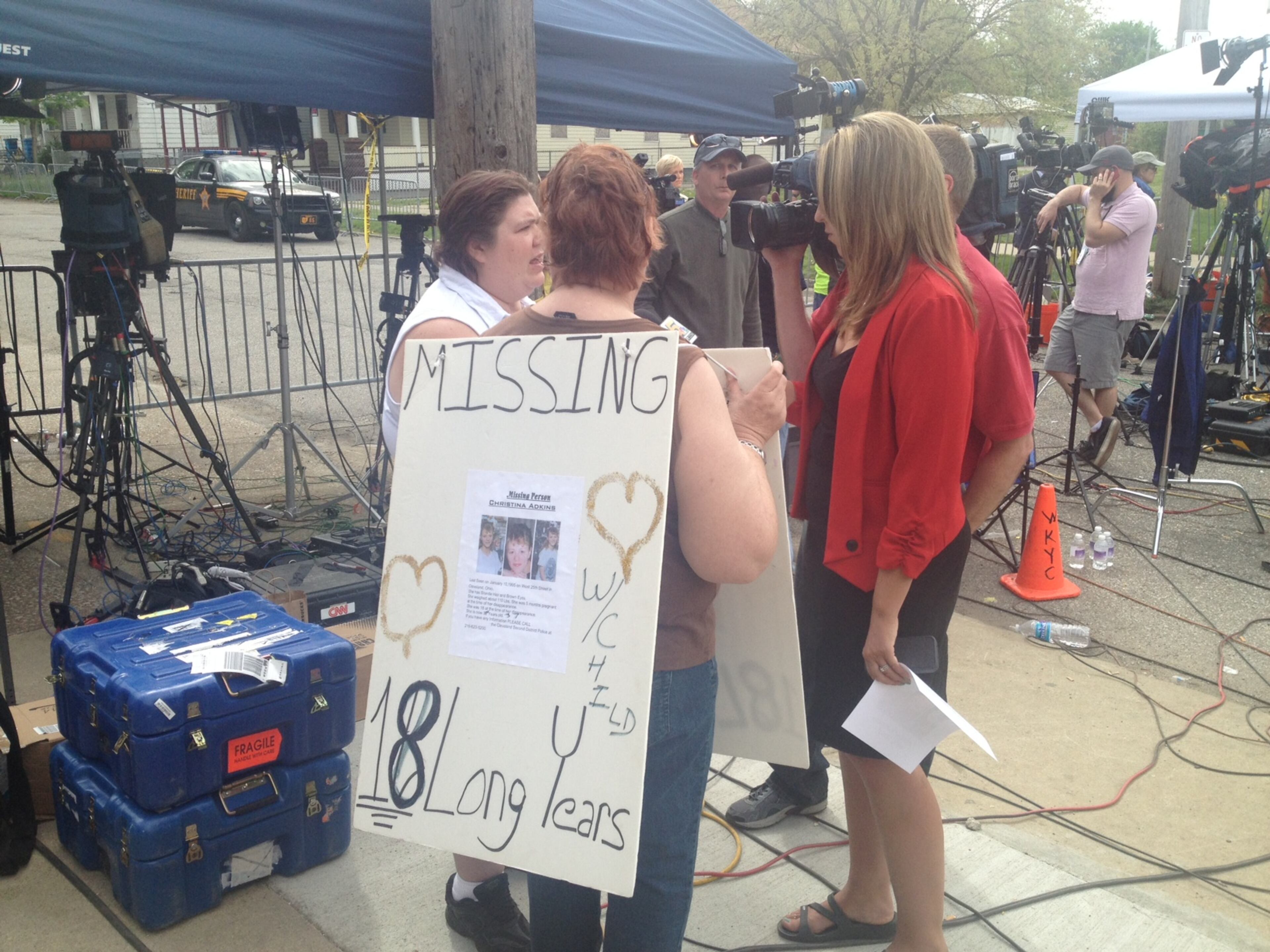 Relatives of a missing girl talk to the media outside the Casto house. Photo: Andrew Tobias/DDN