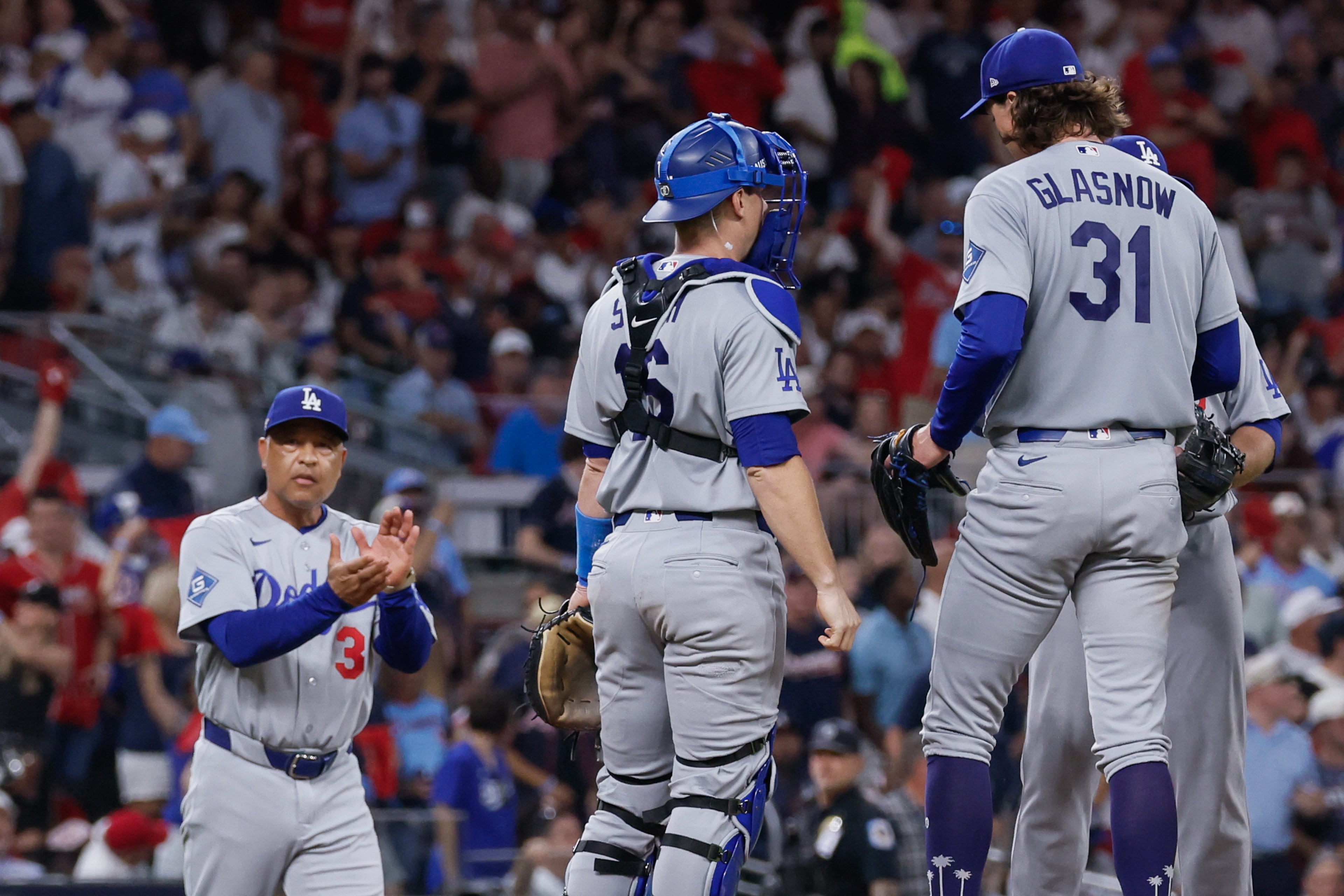 Los Angeles Dodgers pitcher Tyler Glasnow (31) is relieved by manager Dave Roberts, left, during the fifth inning of Game 4 of the MLB National League Division Series between the Atlanta Braves and the Los Angeles Dodgers, Wednesday, Oct. 7, 2026, in Atlanta. (Miguel Martinez/AJC)