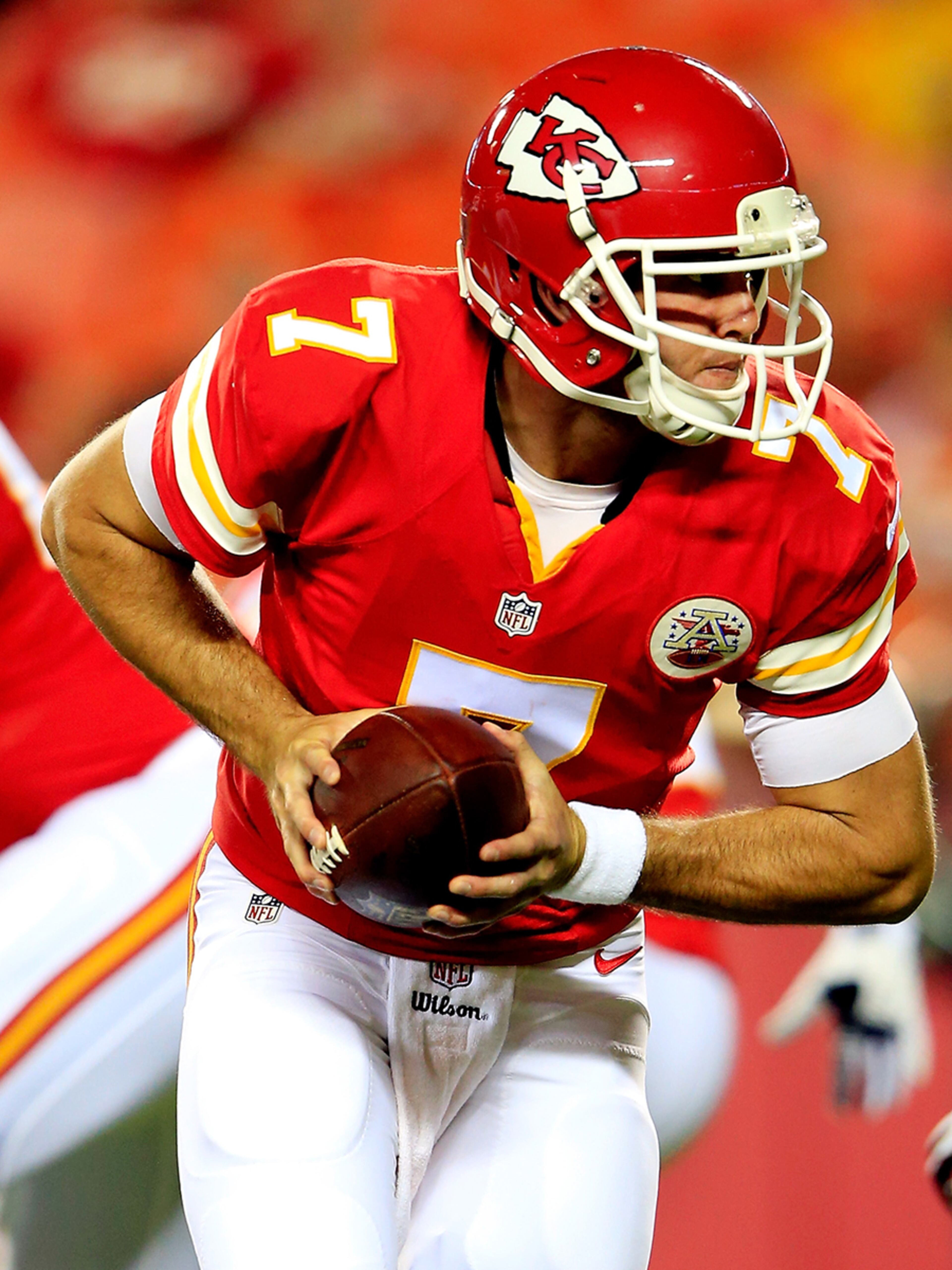 Kansas City Chiefs quarterback Aaron Murray (7), a fifth-round draft pick out of Georgia, hands the ball off to running back Charcandrick West (not pictured) against the Cincinnati Bengals in the opening week of the 2014 NFL preseason at Arrowhead Stadium in Kansas City, Mo. Murray entered the game late and sealed the win with two kneel downs in the 41-39 Chiefs win.
