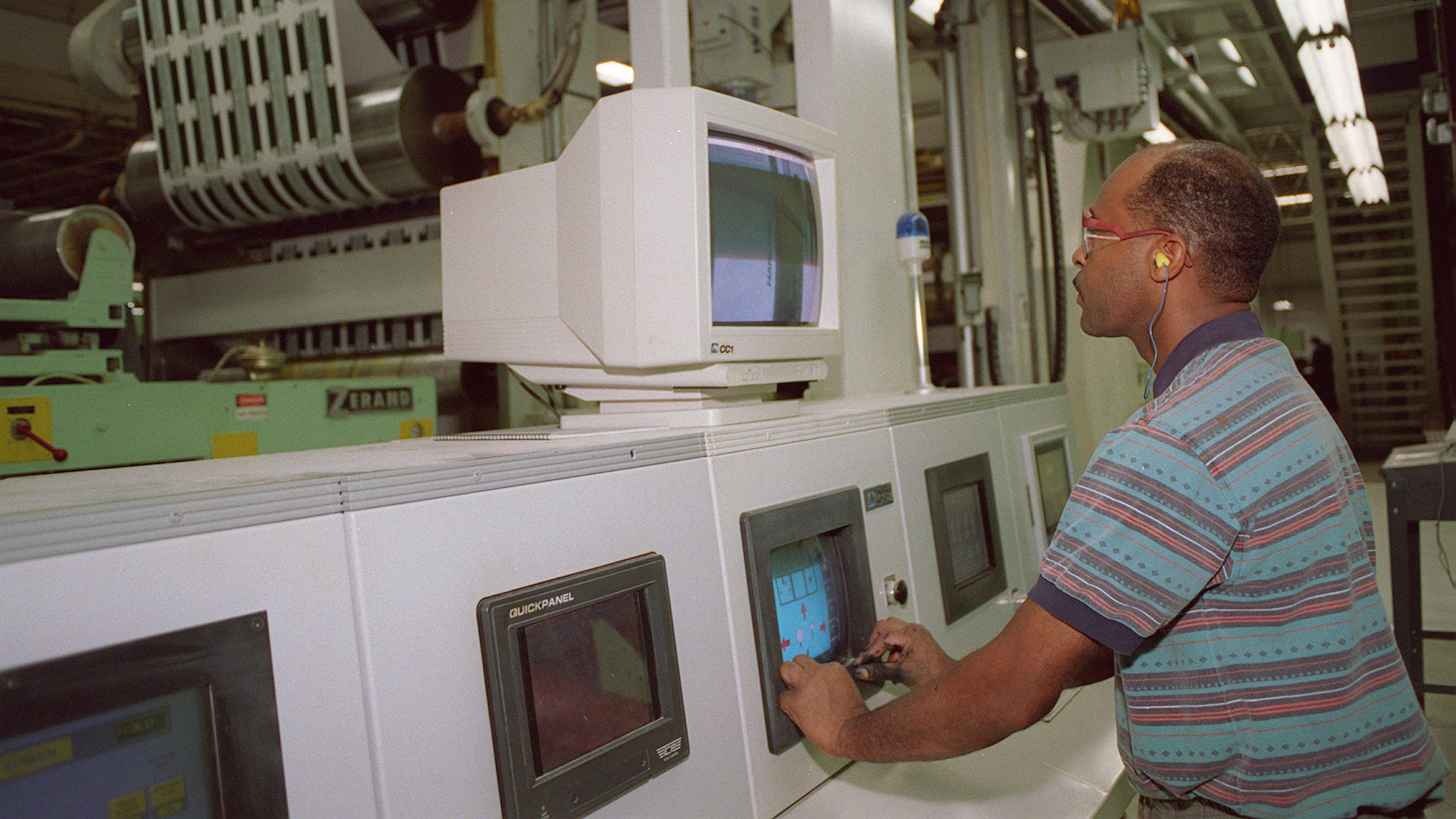 An employee at a metro Atlanta factory of RockTenn, now called WestRock after a 2015 merger, adjusts a printing operation in this 2004 photo. WestRock said Tuesday that it is buying a New York packaging company for $1.4 billion. (AJC Staff Photo/Laura Noel)