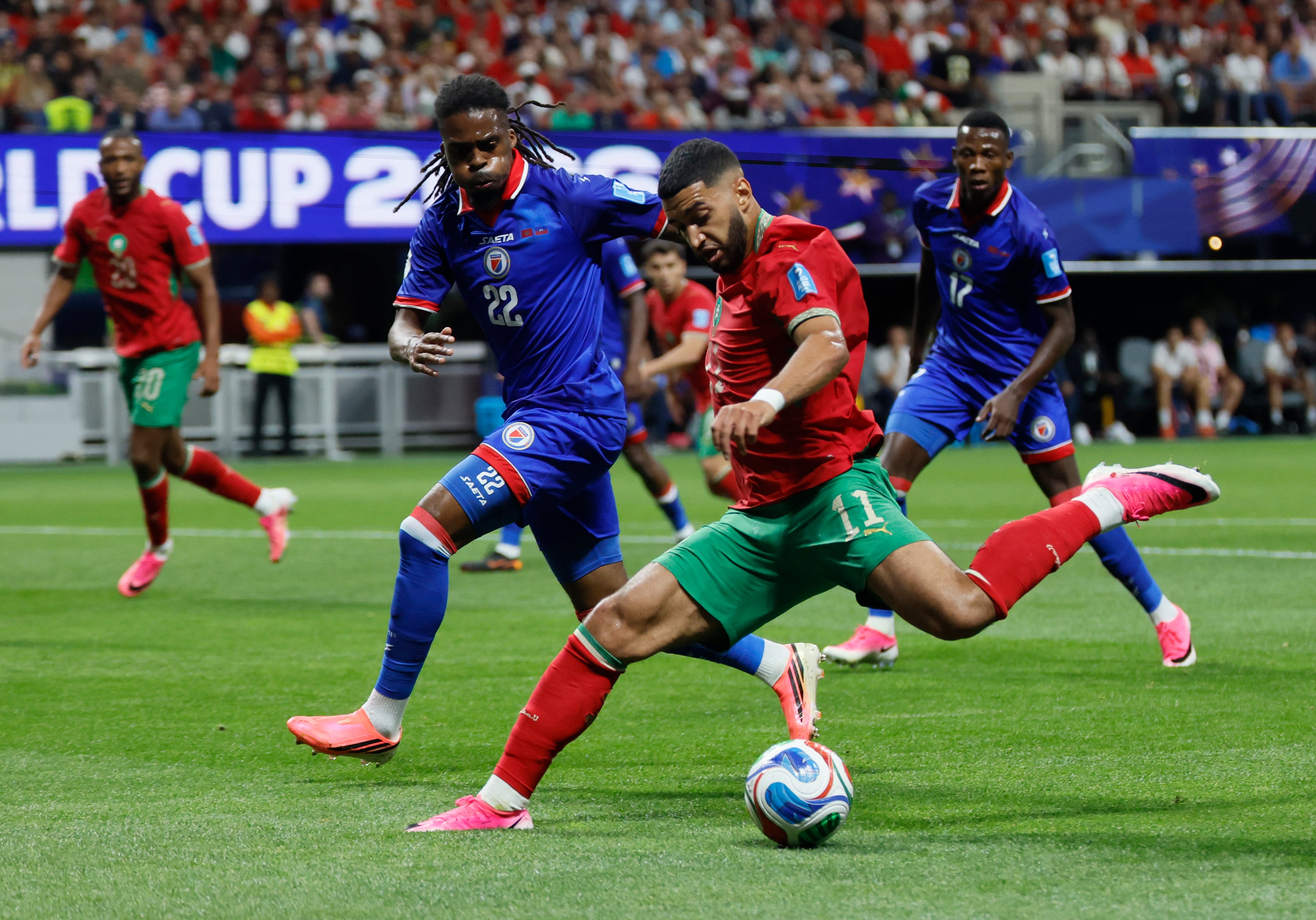 Morocco's Ismael Saibari, right, moves the ball past Haiti's Jean-Kevin Duverne, left, during first half of Morocco vs. Haiti Group C FIFA World Cup match at Atlanta Stadium (Mercedes-Benz Stadium) on Wednesday, June 24, 2026. (Miguel Martinez/AJC)