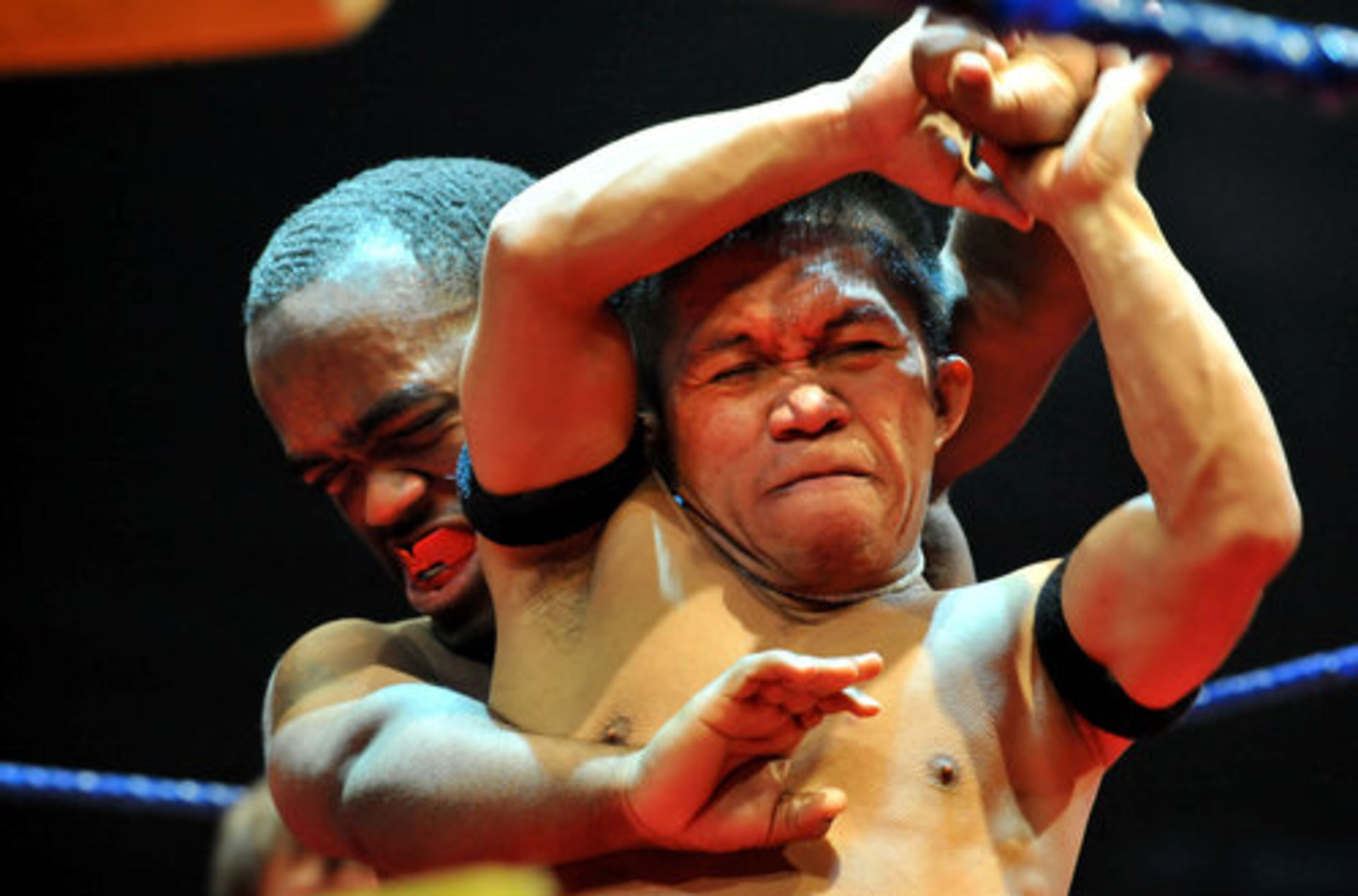 "J-Mazing" Jordan Rafael (right) escapes from Ricky Sells' headlock. Rafael, a native of the Philippines, is a former dwarf cage-fighting champion as well as a former midget Chippendale. Sells' stage name is Ricky Benjamin.