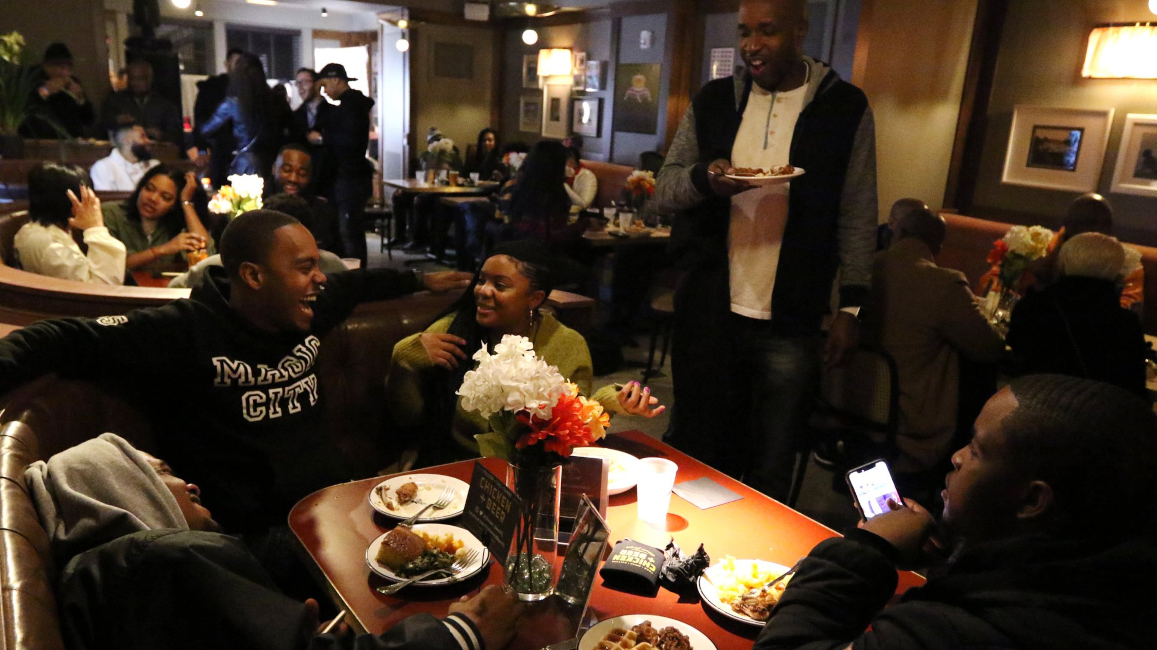 People attend Ludacris’ late night party at the Hotel Clermont in Atlanta early Friday morning. Chicken+Beer food was served to the guests. EMILY HANEY / EMILY.HANEY@AJC.COM