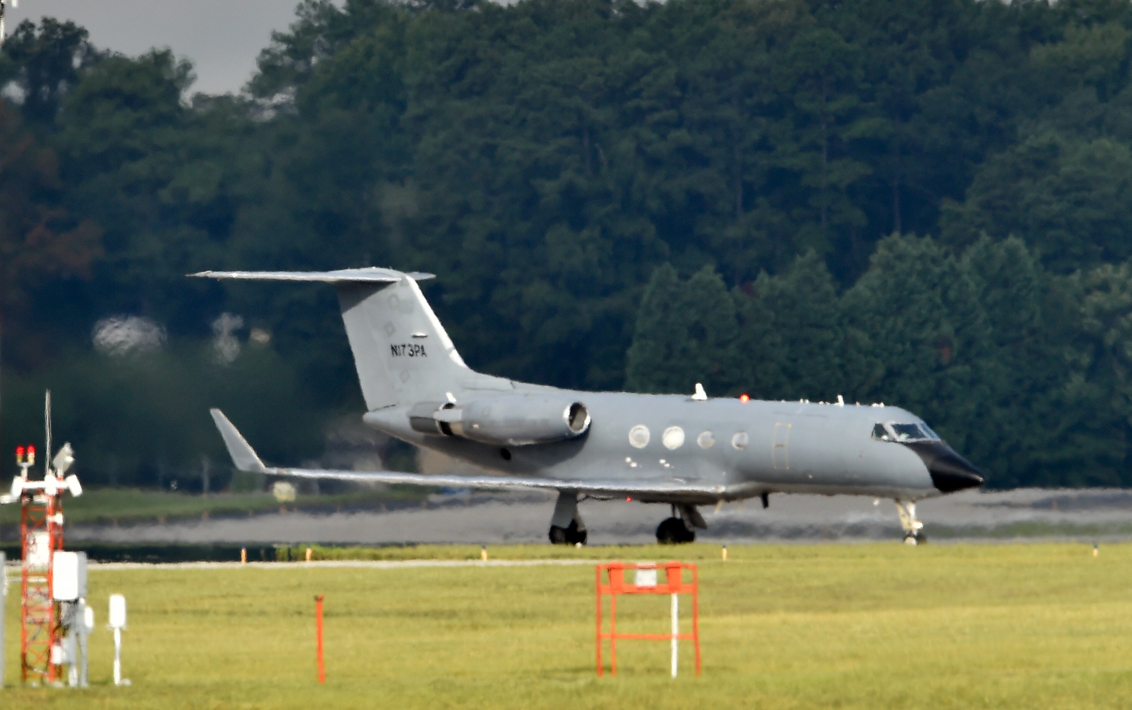 An airplane transporting an American infected with the deadly Ebola virus in West Africa, lands at Dobbins Air Reserve Base Tuesday, Sept. 9, 2014 in Marietta, Ga. A joint emergency isolation unit administered by Emory University Hospital and the Centers for Disease Control and Prevention successfully treated two Americans last month in Atlanta. (AP Photo/David Tulis)