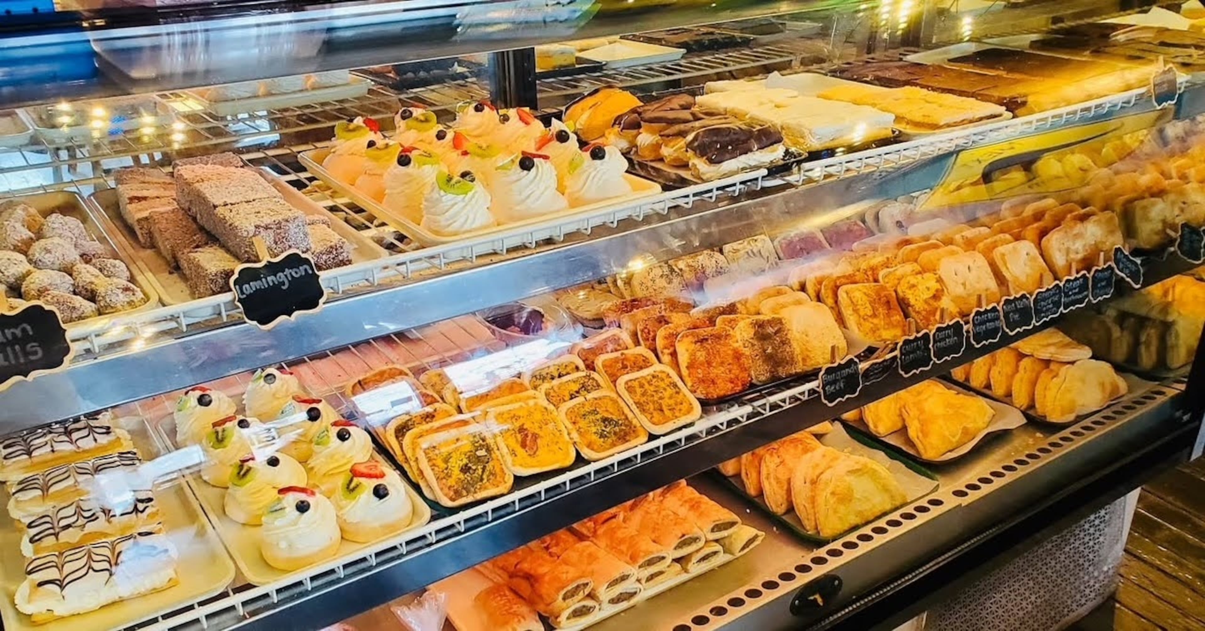 Australian Bakery Cafe's display case of desserts, cookies, meat pies, hand pies and sausage rolls. (Courtesy of Australian Bakery Cafe)