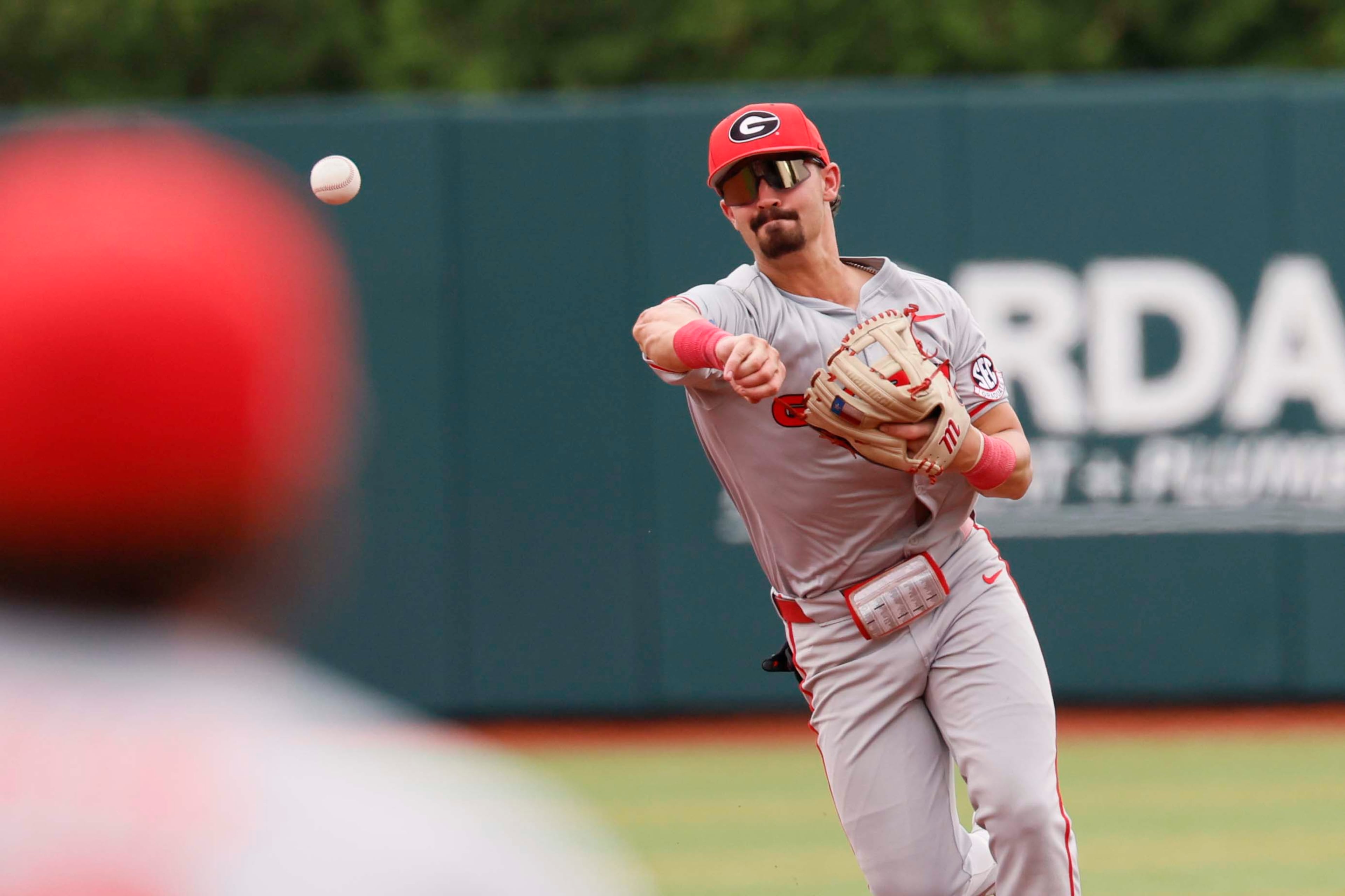 Georgia Bulldogs infielder Kolby Branch (9) throws for an out during the third inning of their game 2 of the NCAA Super Regional at Foley Field on Sunday, June 7, 2026, in Athens. Miguel Martinez/AJC)