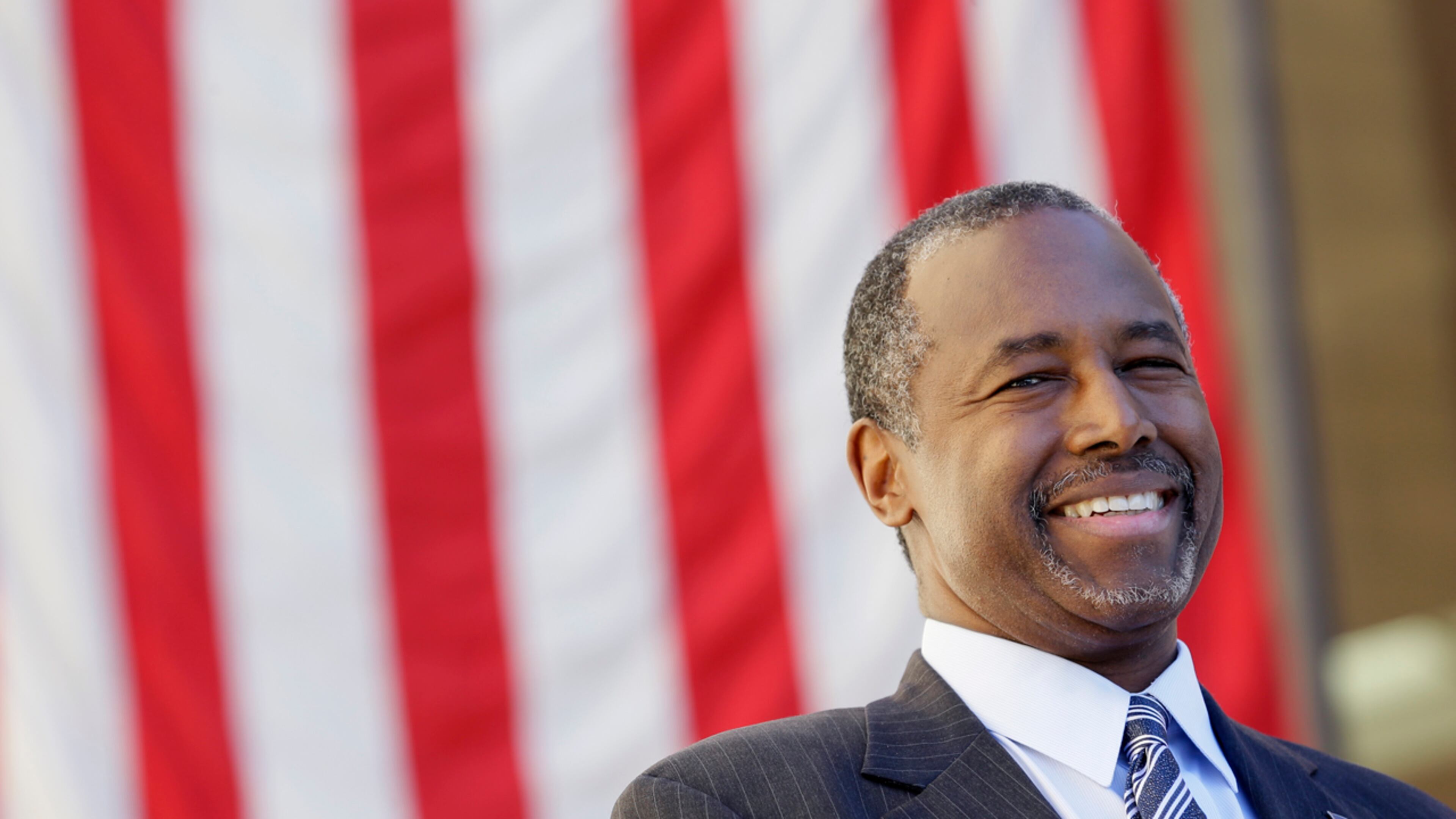 Republican presidential candidate Dr. Ben Carson looks on as he is introduced to speak at a town hall meeting, Friday, Oct. 2, in Ankeny, Iowa.