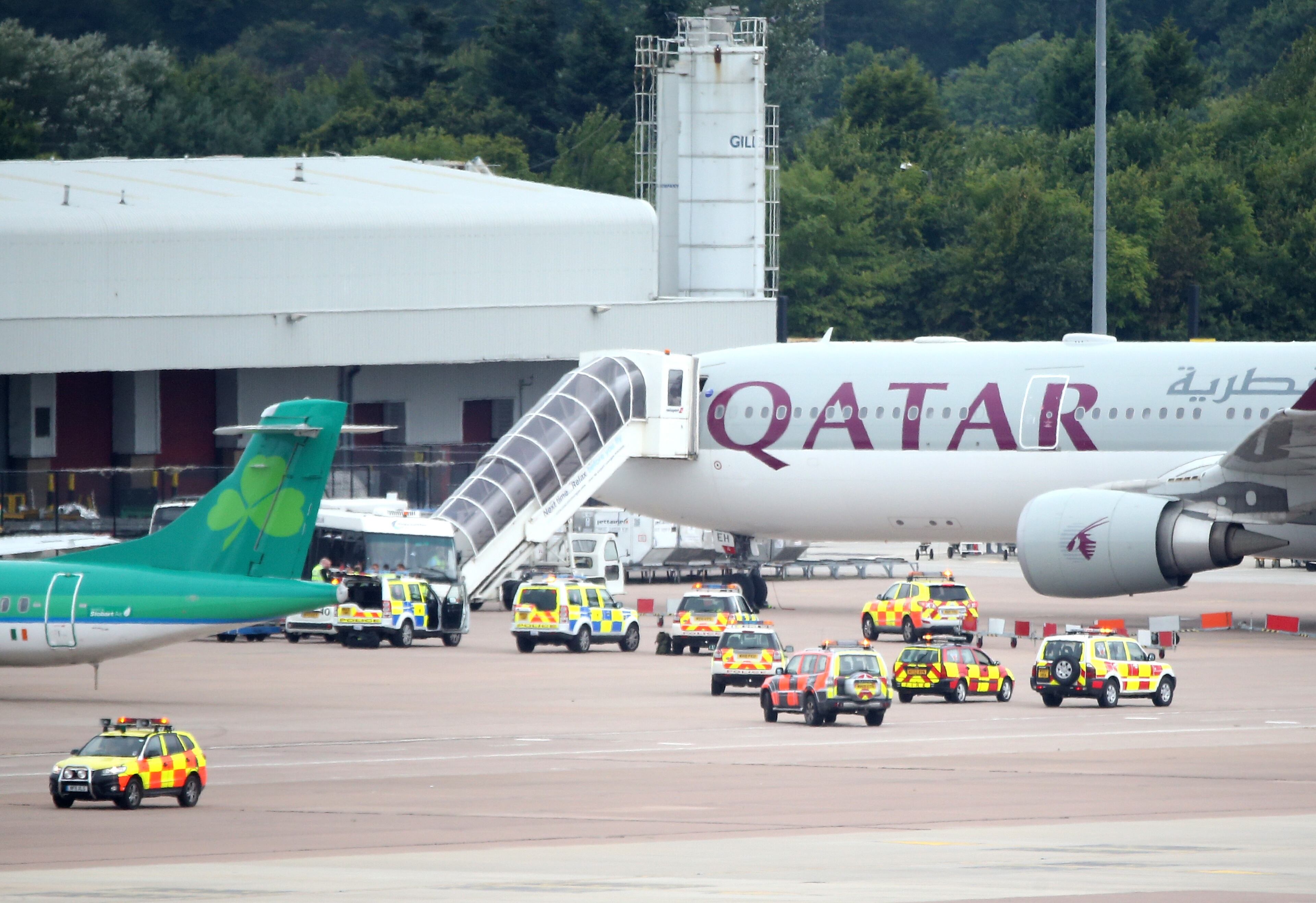A Qatar Airways flight from Doha sits on the tarmac at the Manchester Airport, in Manchester, England.