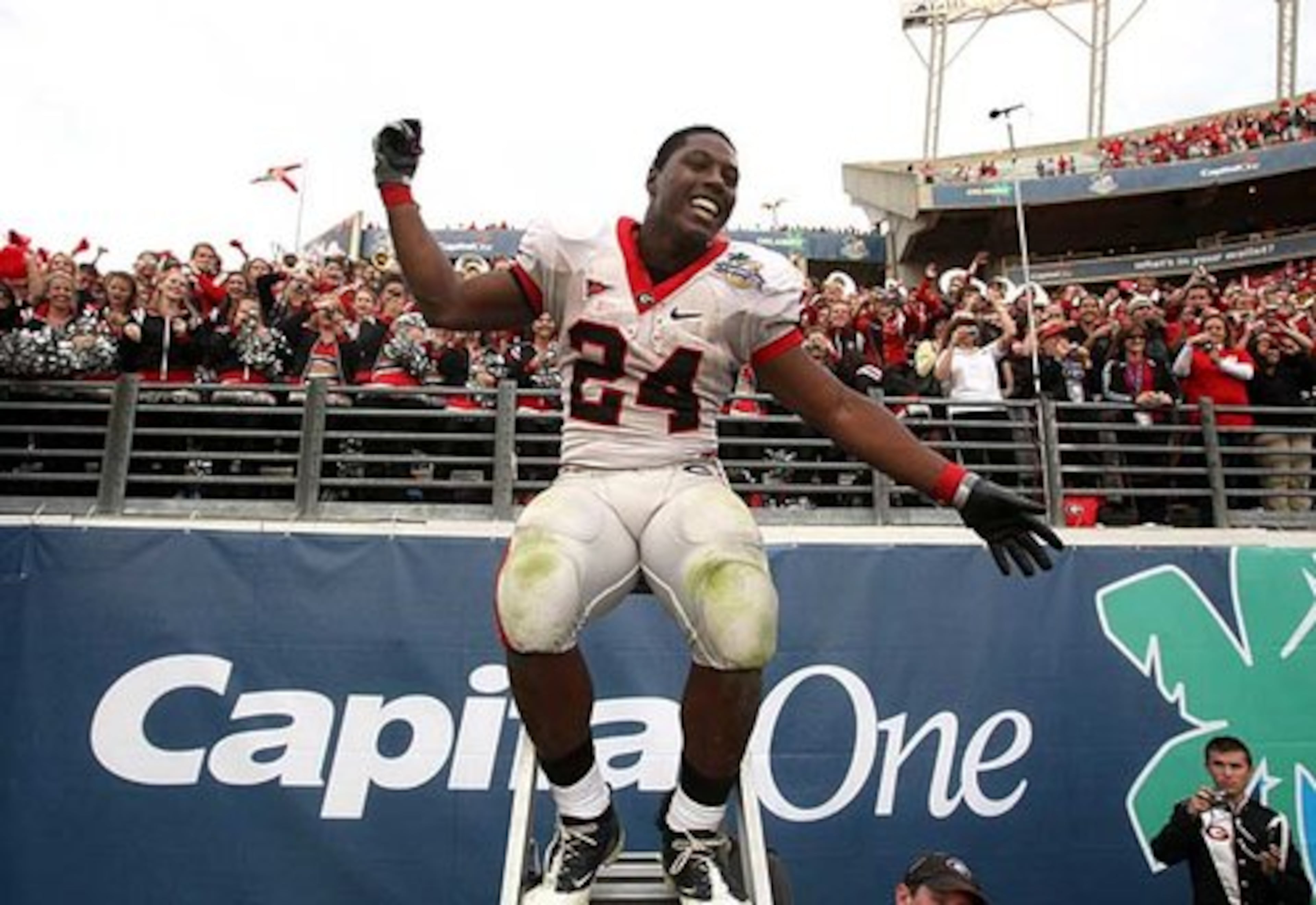 Running back Knowshon Moreno celebrates by leading the band after the Bulldogs defeated Michigan State in the Capital One Bowl.