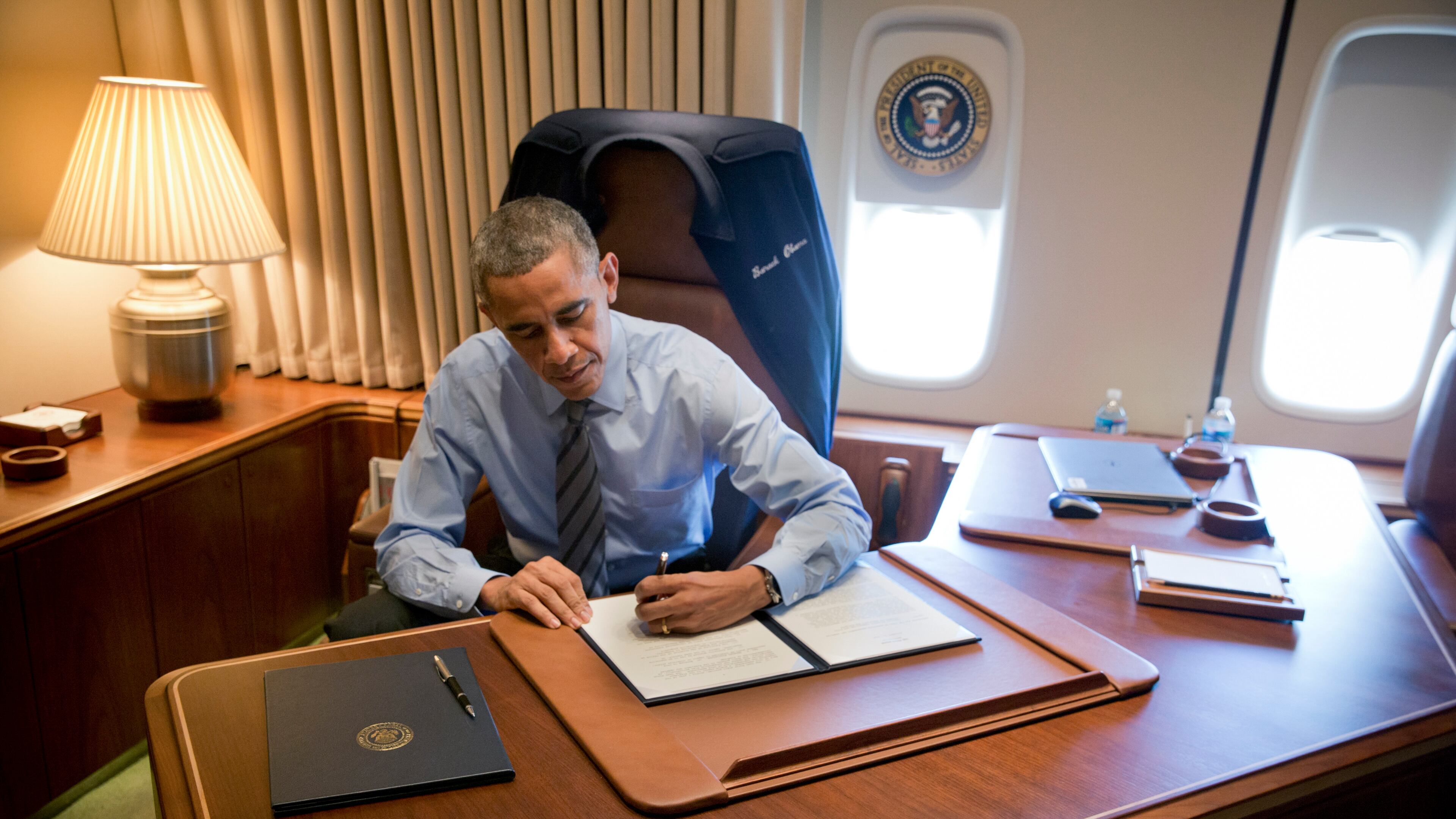 President Barack Obama used his "pen," seen here aboard Air Force One in November 2014, to try to make immigration law. The Supreme Court, for now, said he should have used his "phone." (Stephen Crowley / The New York Times)