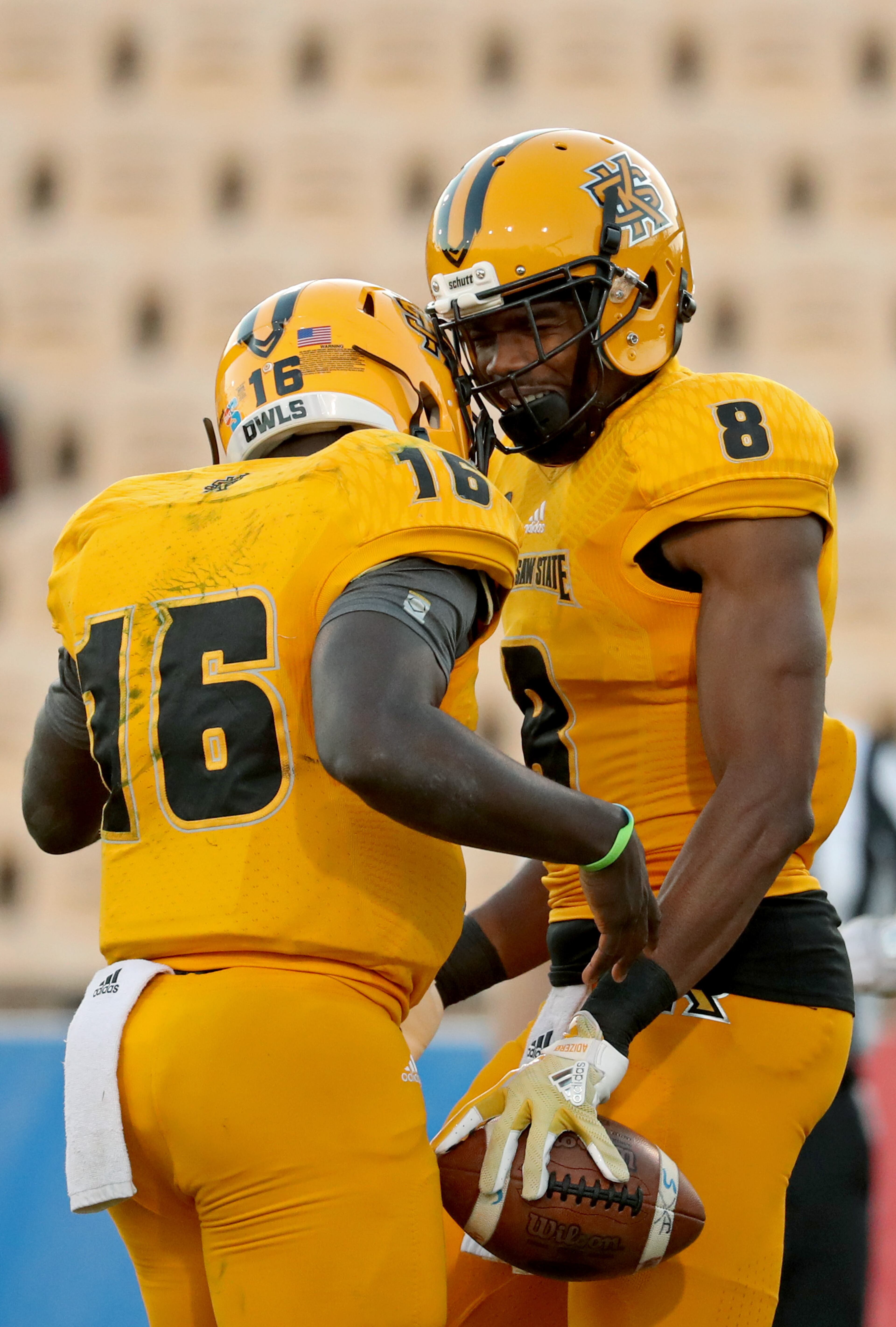 March 22, 2019 - Kennesaw, Ga: Kennesaw State Owls wide receiver Monte Jones (8) celebrates his touchdown with quarterback Jonathan Murphy (16) during the KSU spring football game at Fifth Third Bank Stadium Friday, March 22, 2019 in Kennesaw, Ga.. (JASON GETZ/SPECIAL TO THE AJC)