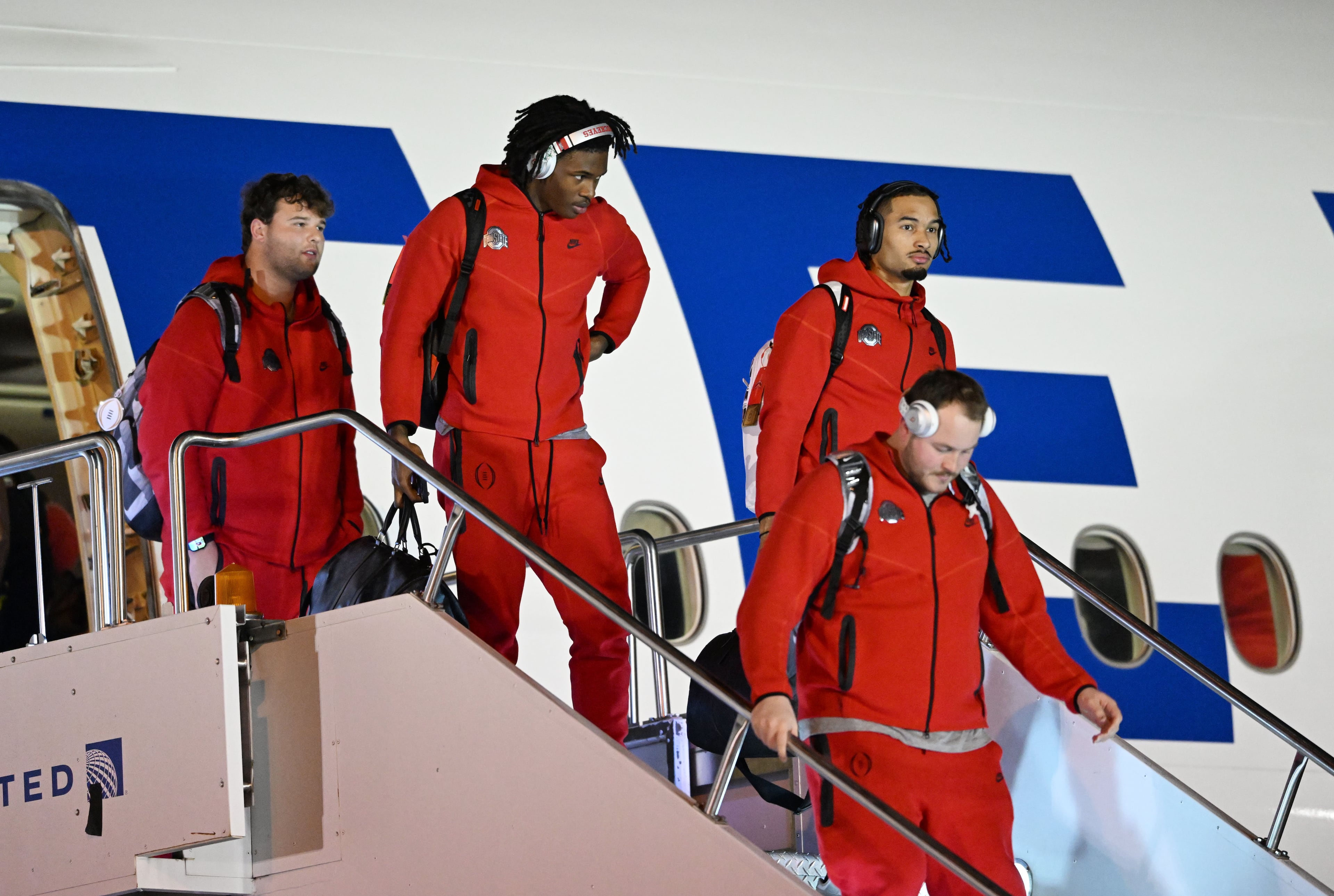 Ohio State players and staff arrive at Hartsfield-Jackson Atlanta International Airport ahead of the 2025 College Football National Championship between Notre Dame and Ohio State, Friday, January 17, 2025, in Atlanta. (Hyosub Shin / AJC)