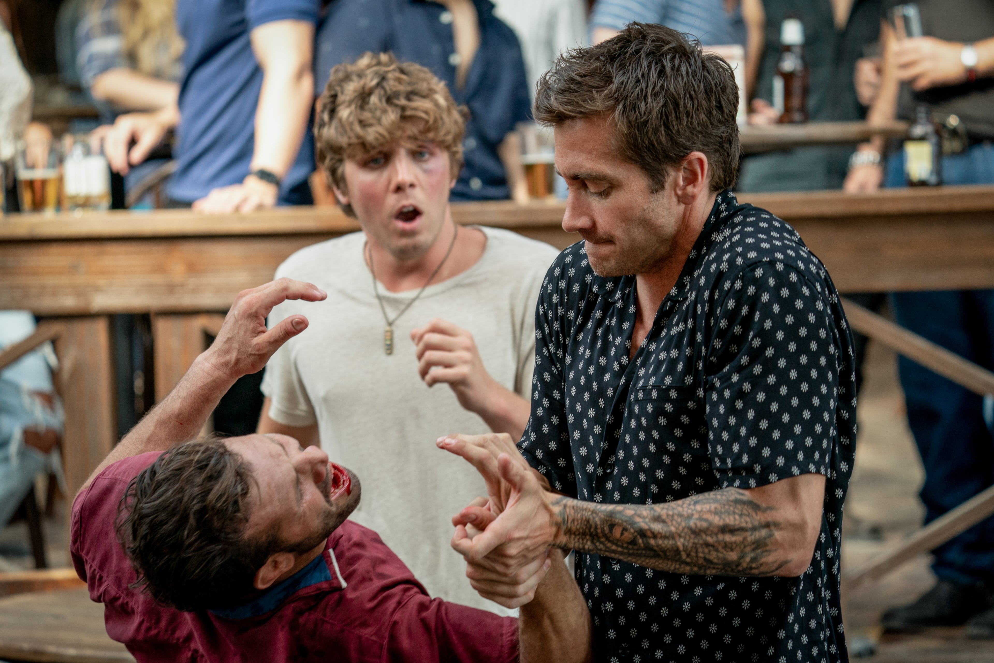 Lukas Gage (center, background) and Jake Gyllenhaal (right) are expected to be back for "Road House 2," a sequel to the 2024 Amazon Prime film. (Courtesy of Laura Radford/Amazon Content Services LLC)