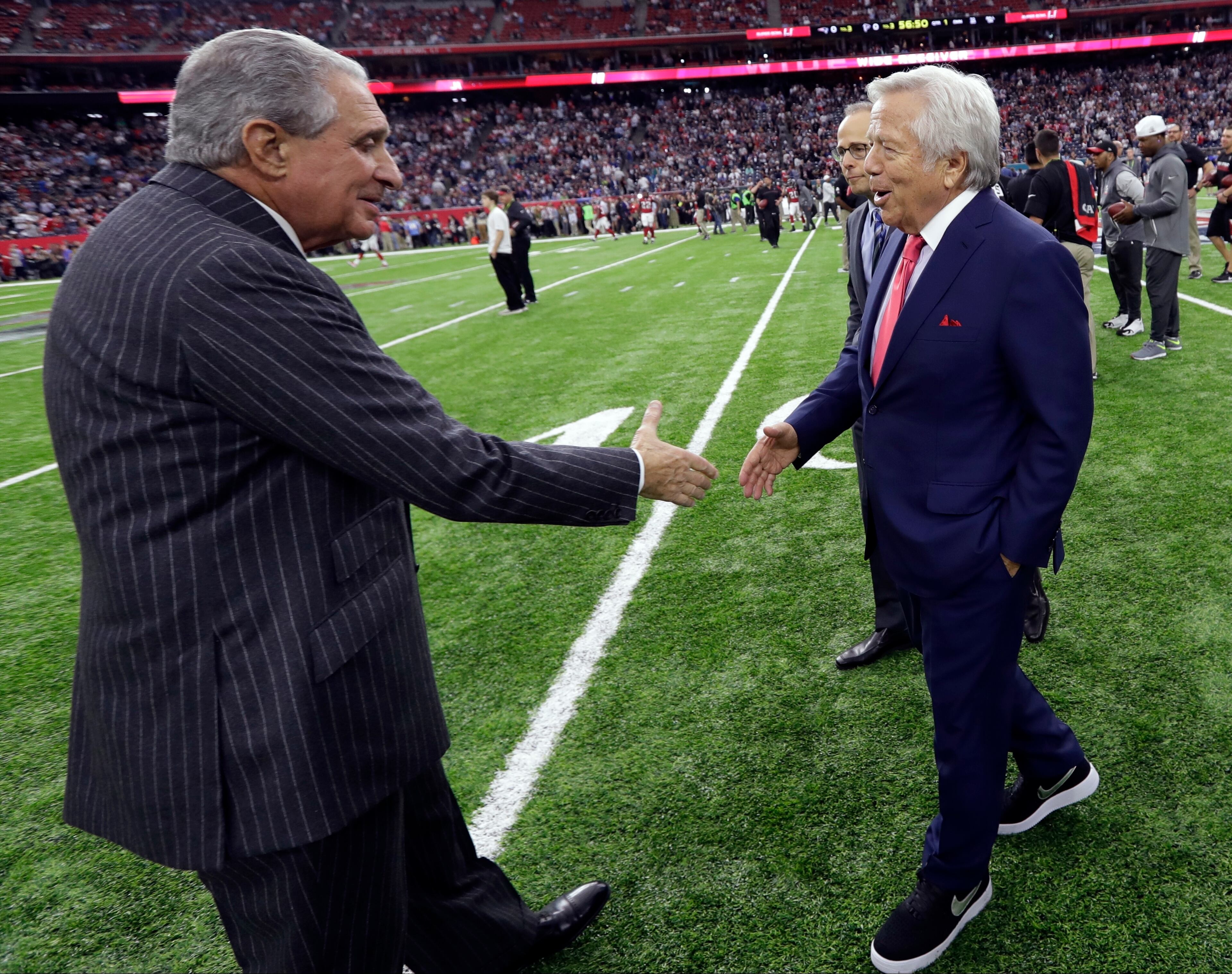 New England Patriots owner Robert Kraft, right, greets Atlanta Falcons owner Arthur Blank before the NFL Super Bowl 51 football game Sunday, Feb. 5, 2017, in Houston. (AP Photo/David J. Phillip)
